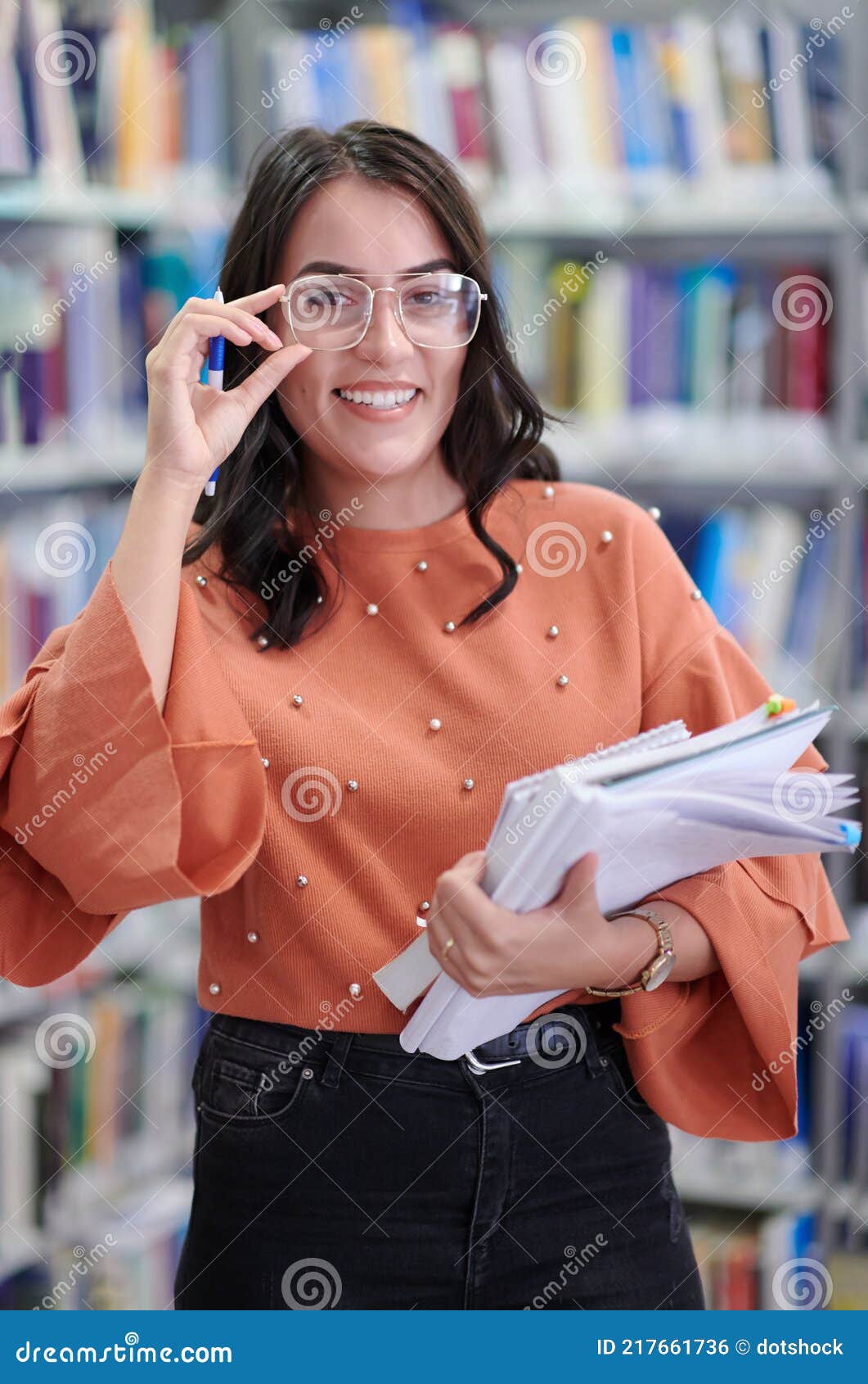 The Student Uses a Notebook and a School Library Stock Photo Image of