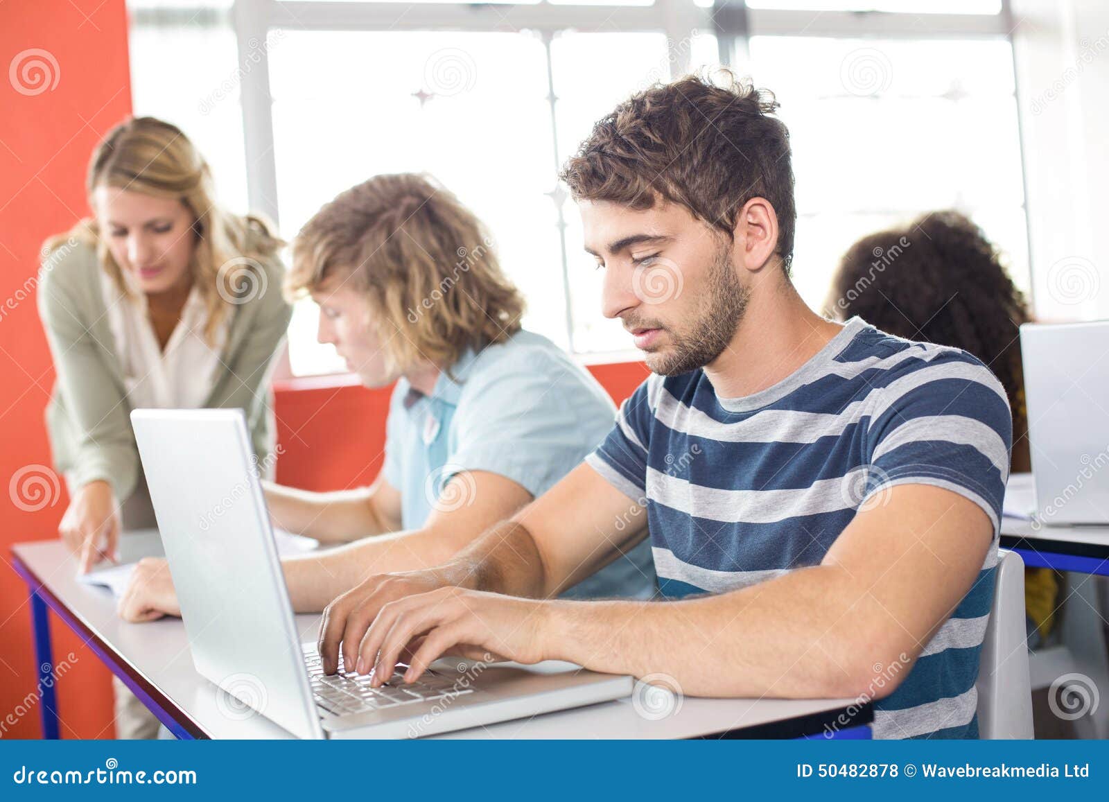 Student Using Laptop in Classroom Stock Photo Image of mixedrace