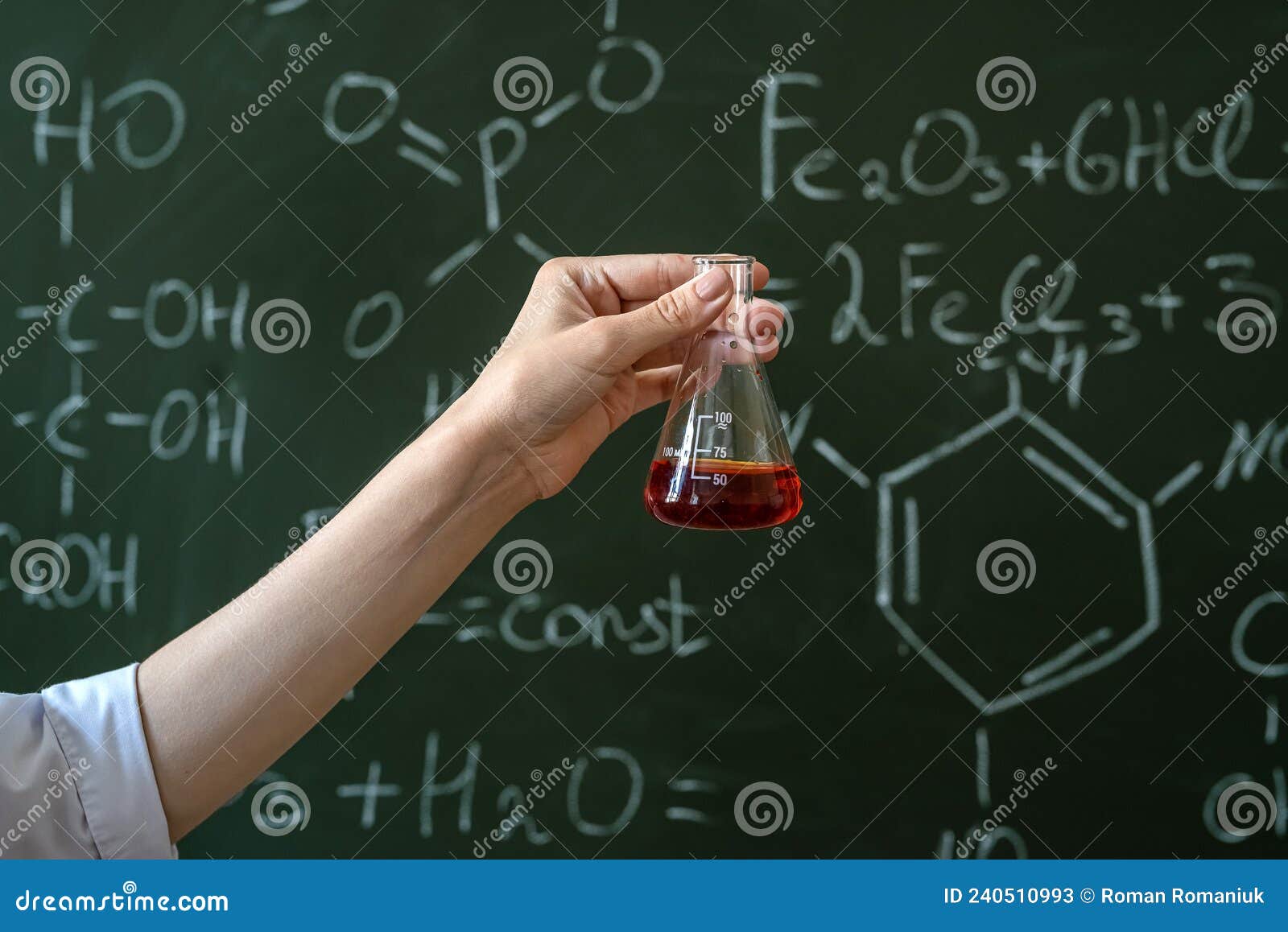 Student in White Coat Doing Experiment Test in Chemistry Laboratory