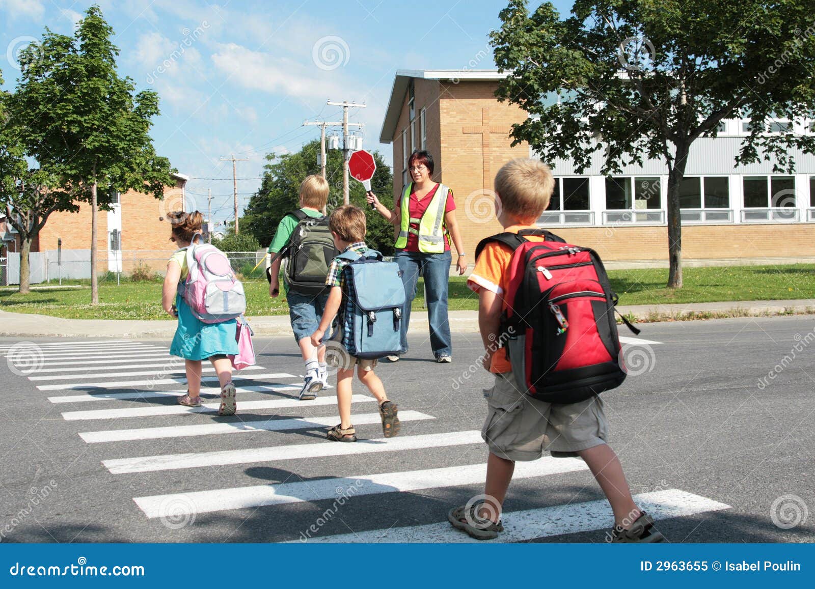 Teacher and pupils crossing road Stock Photo - Alamy