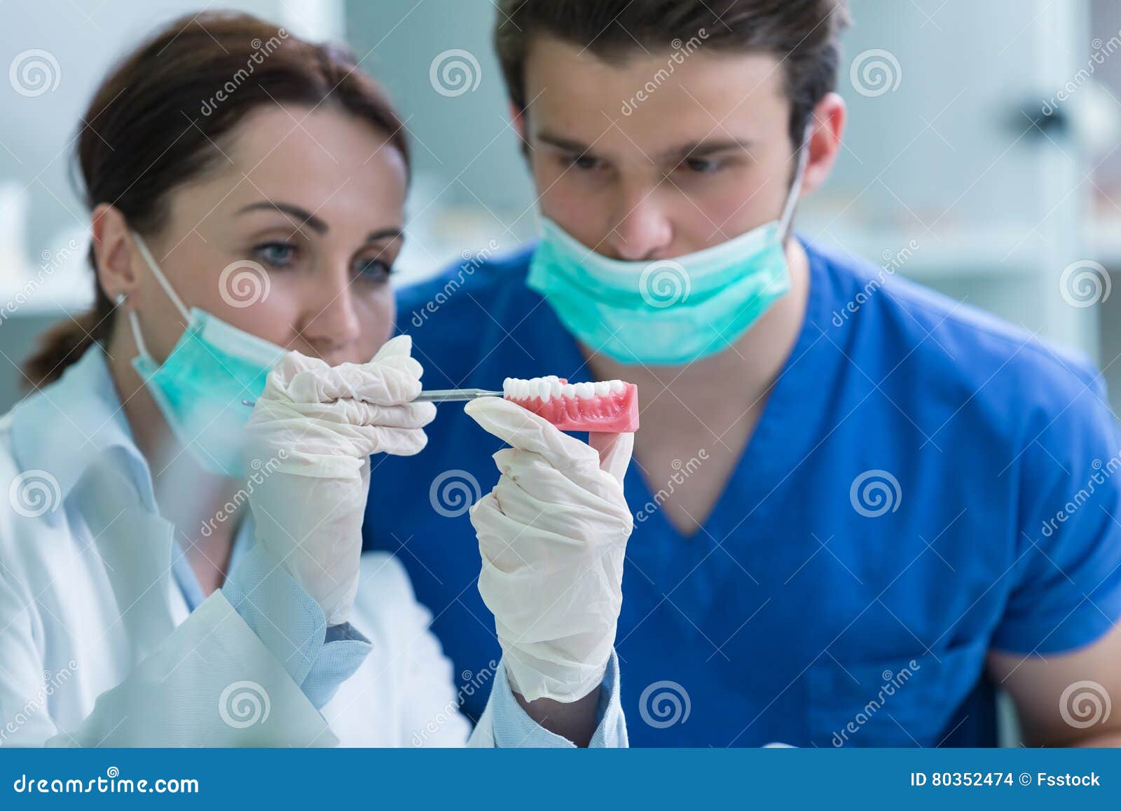 Students with Dental Prosthesis, Dentures, Prosthetics Work. Stock
