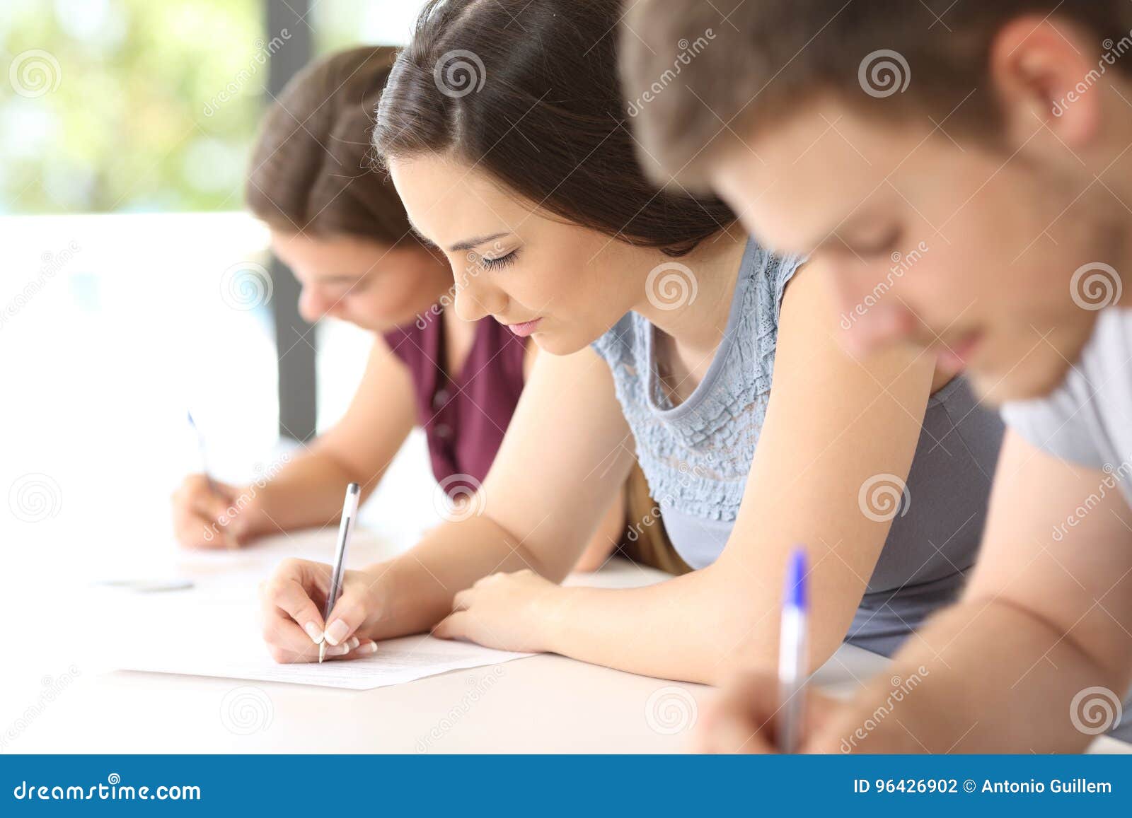 students doing an exam in a classroom