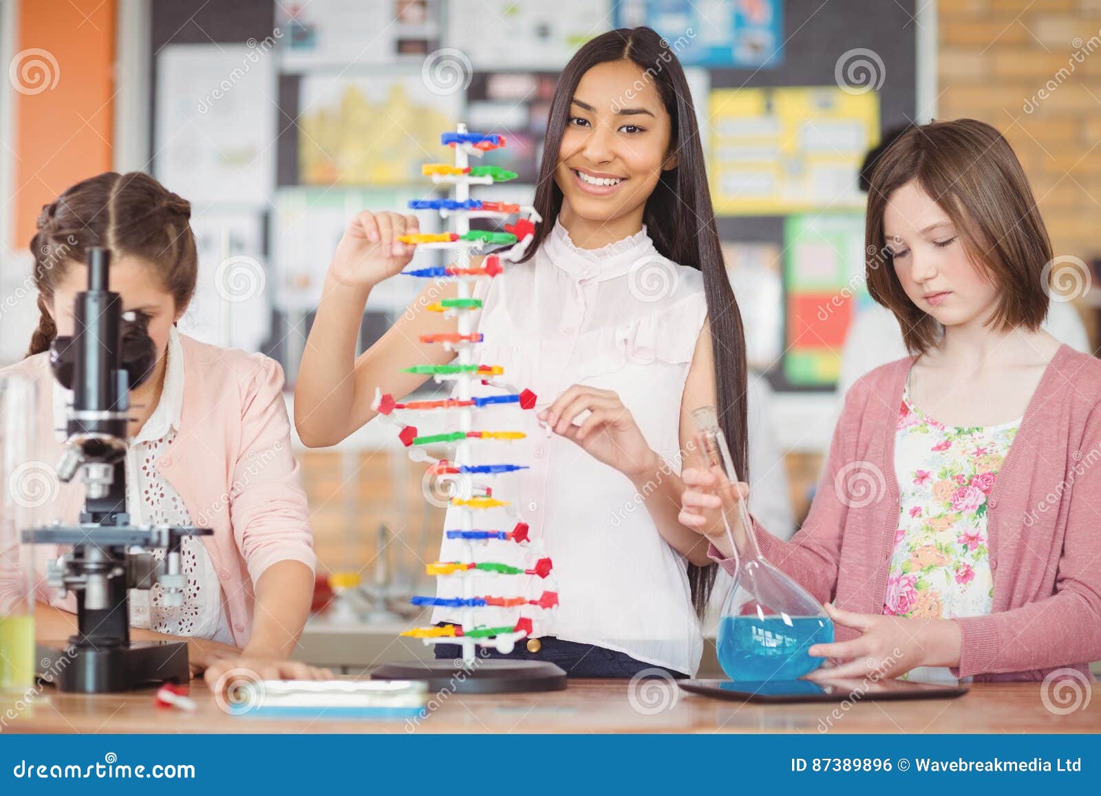 Students Experimenting Molecule Model in Laboratory Stock Photo Image