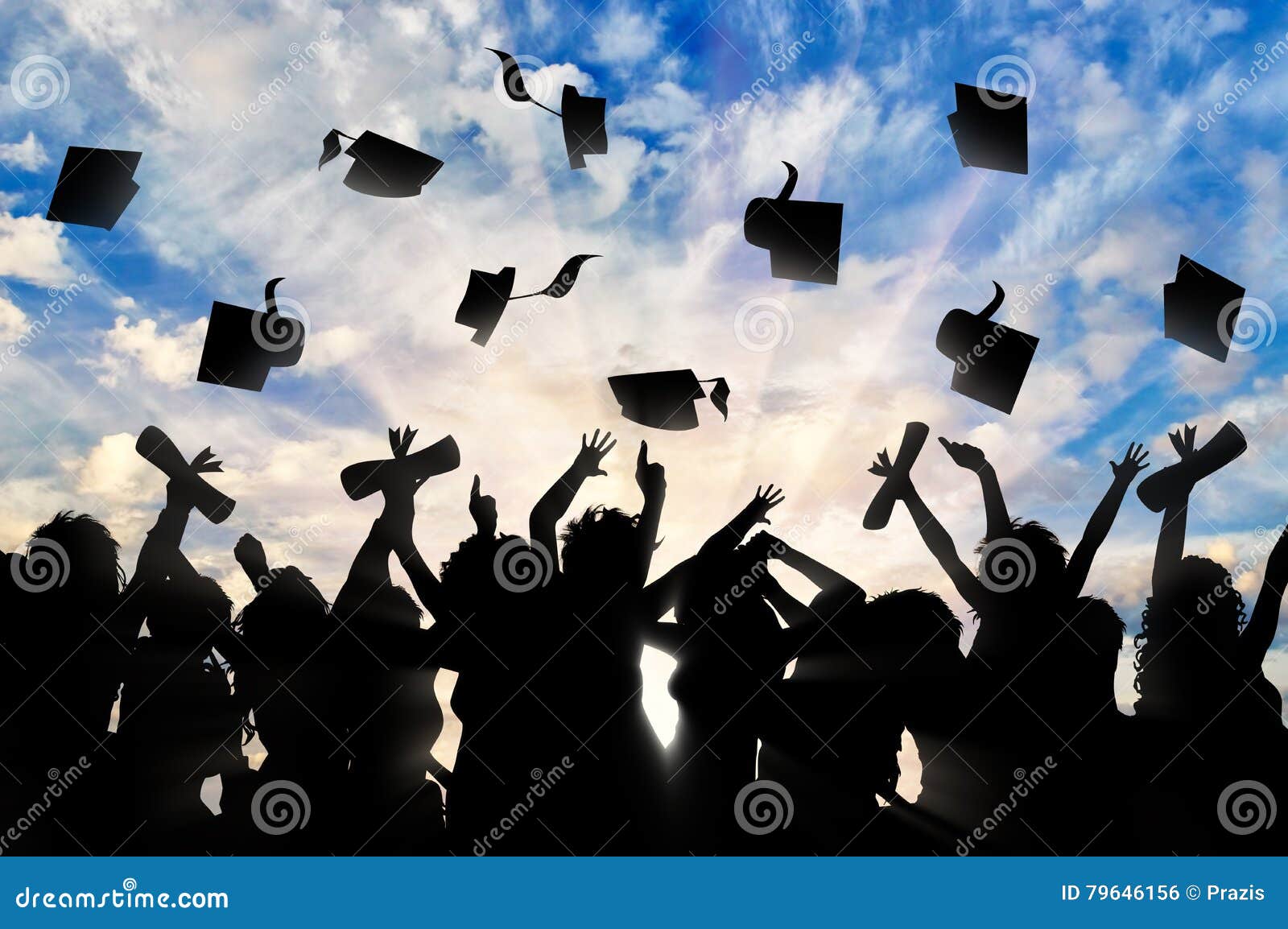 students graduate cap throwing in sky