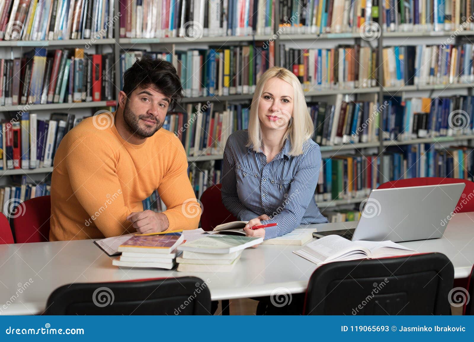 Couple Of Students With Laptop In Library Stock Image Image Of Blond