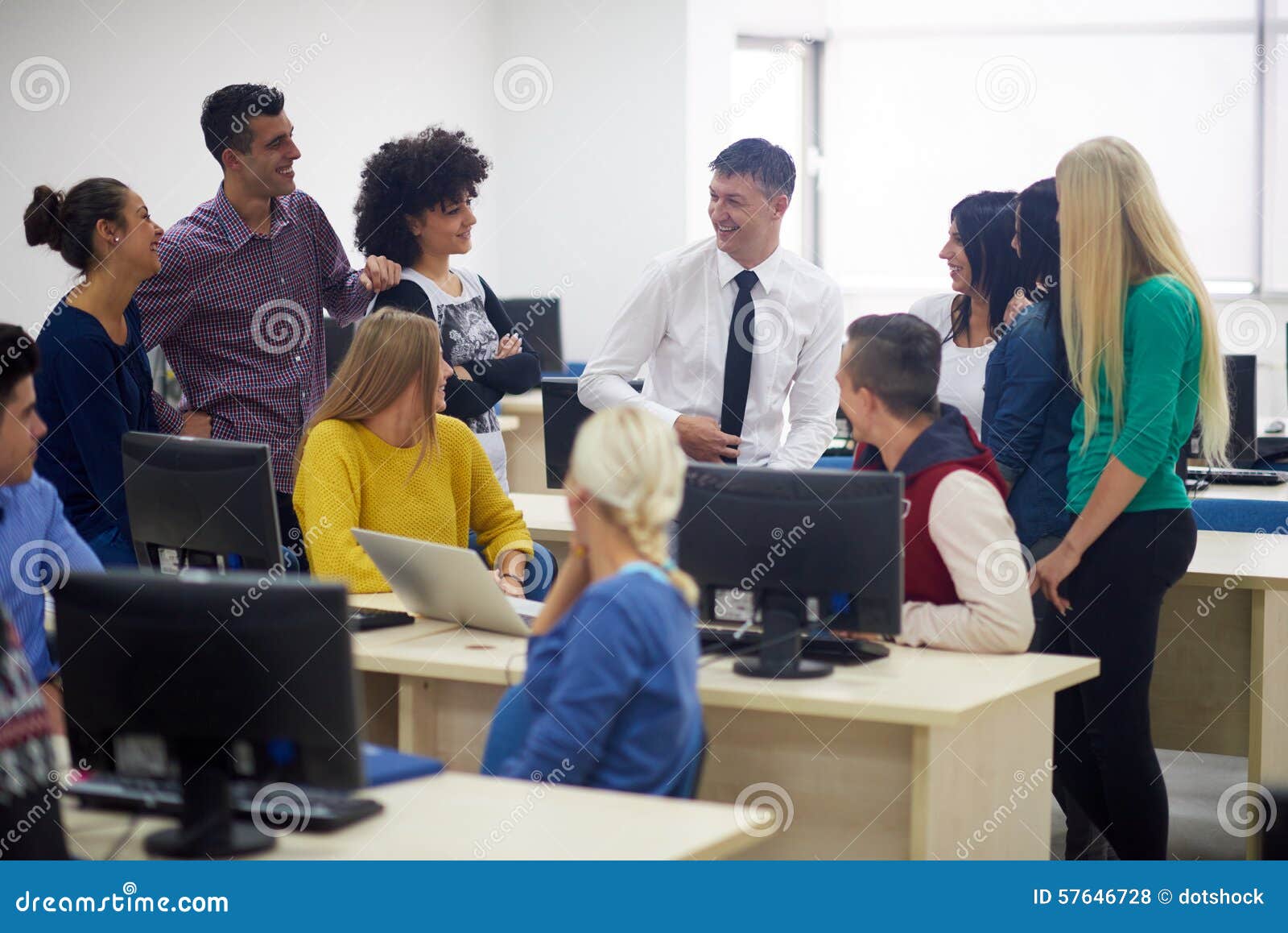 students with teacher in computer lab classrom