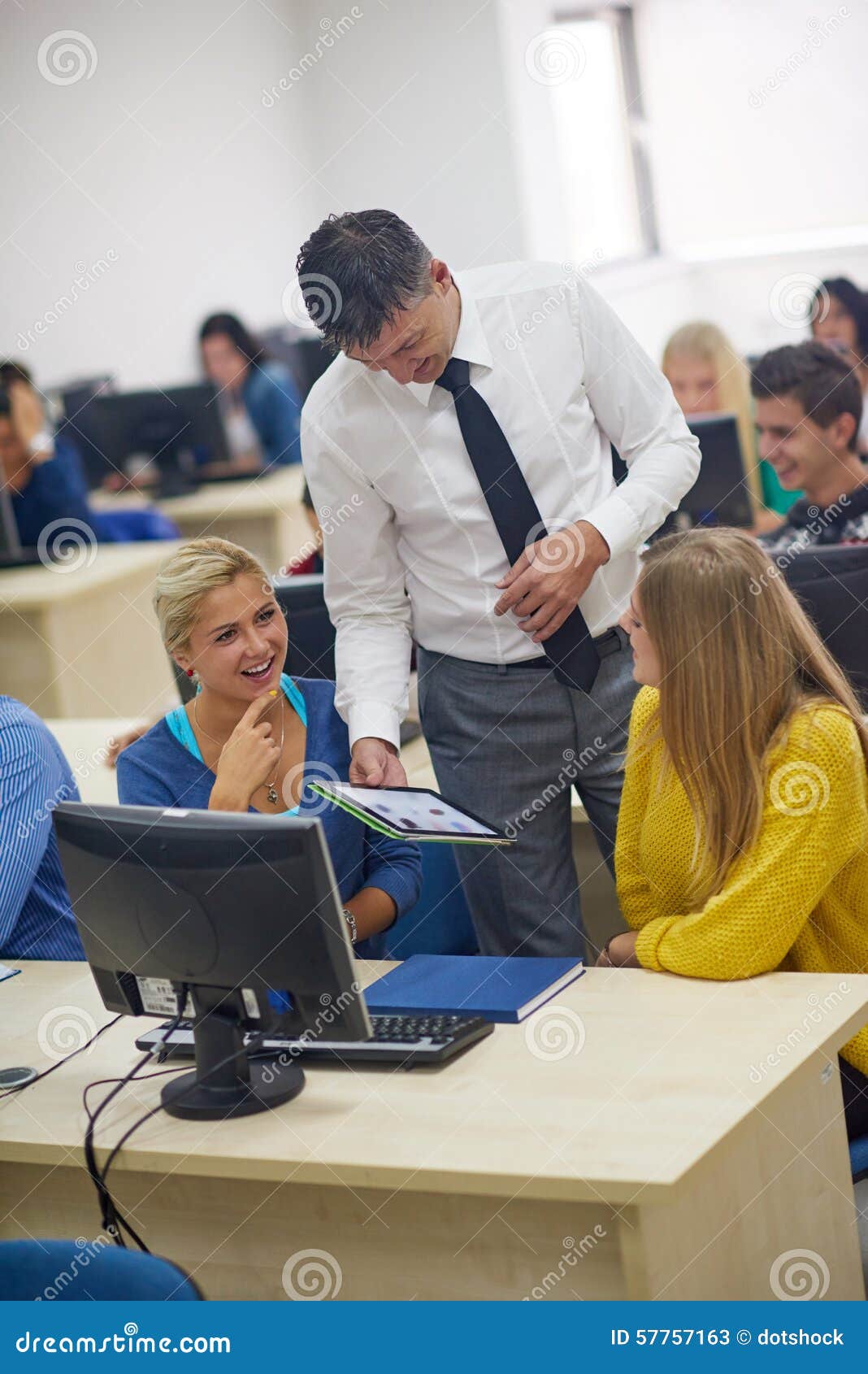 students with teacher in computer lab classrom