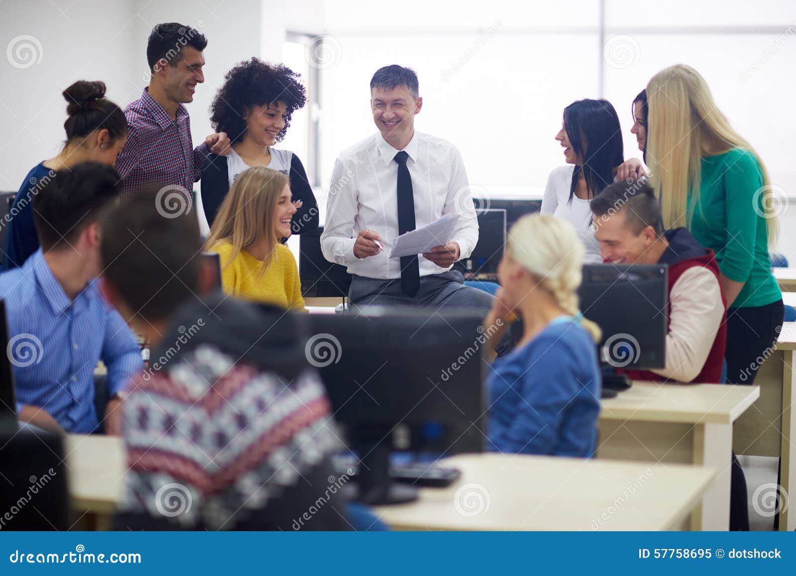 students with teacher in computer lab classrom
