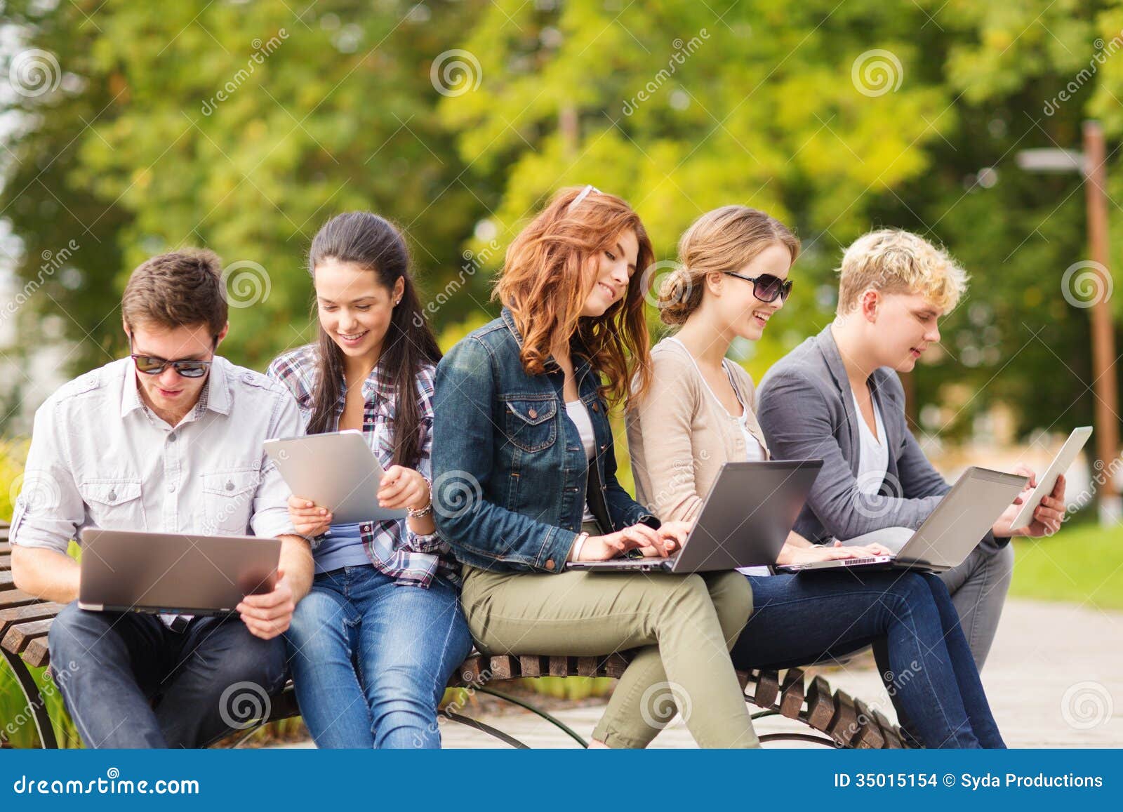 students or teenagers with laptop computers