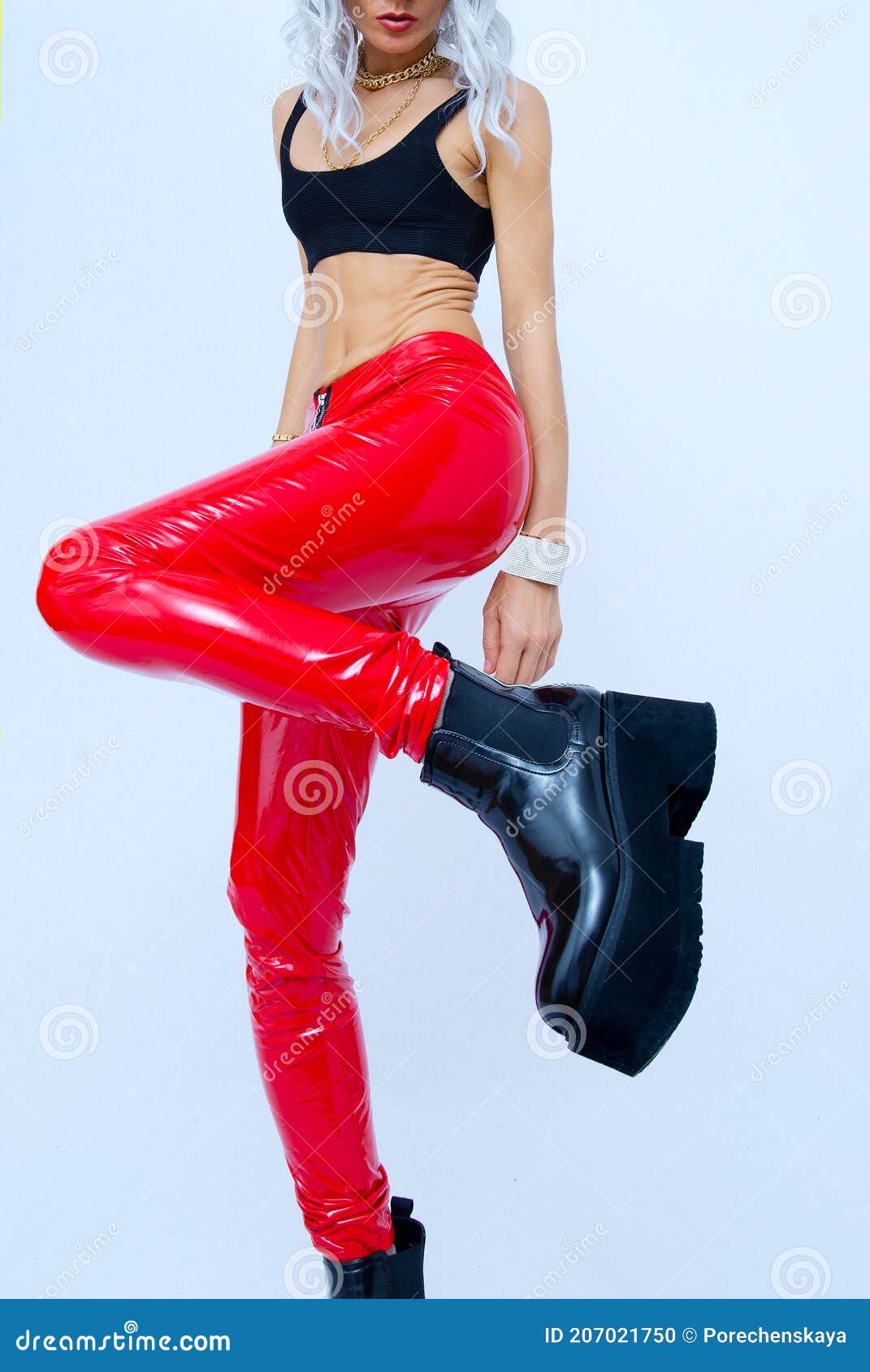 Studio Fashion Portrait of Blonde Wearing Red Leather Pants and