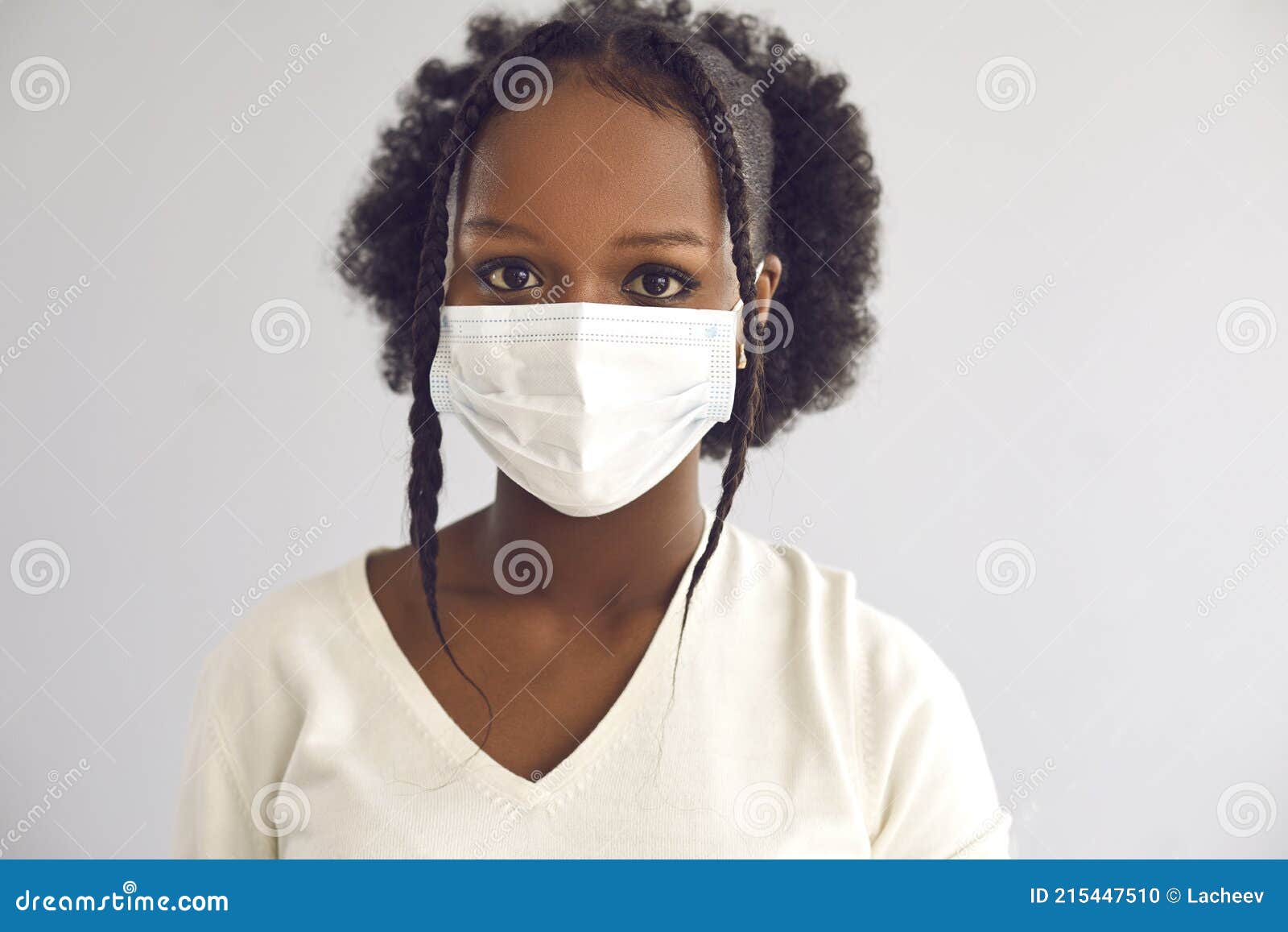 Studio Headshot of a Young African Woman Wearing a Disposable Surgical ...