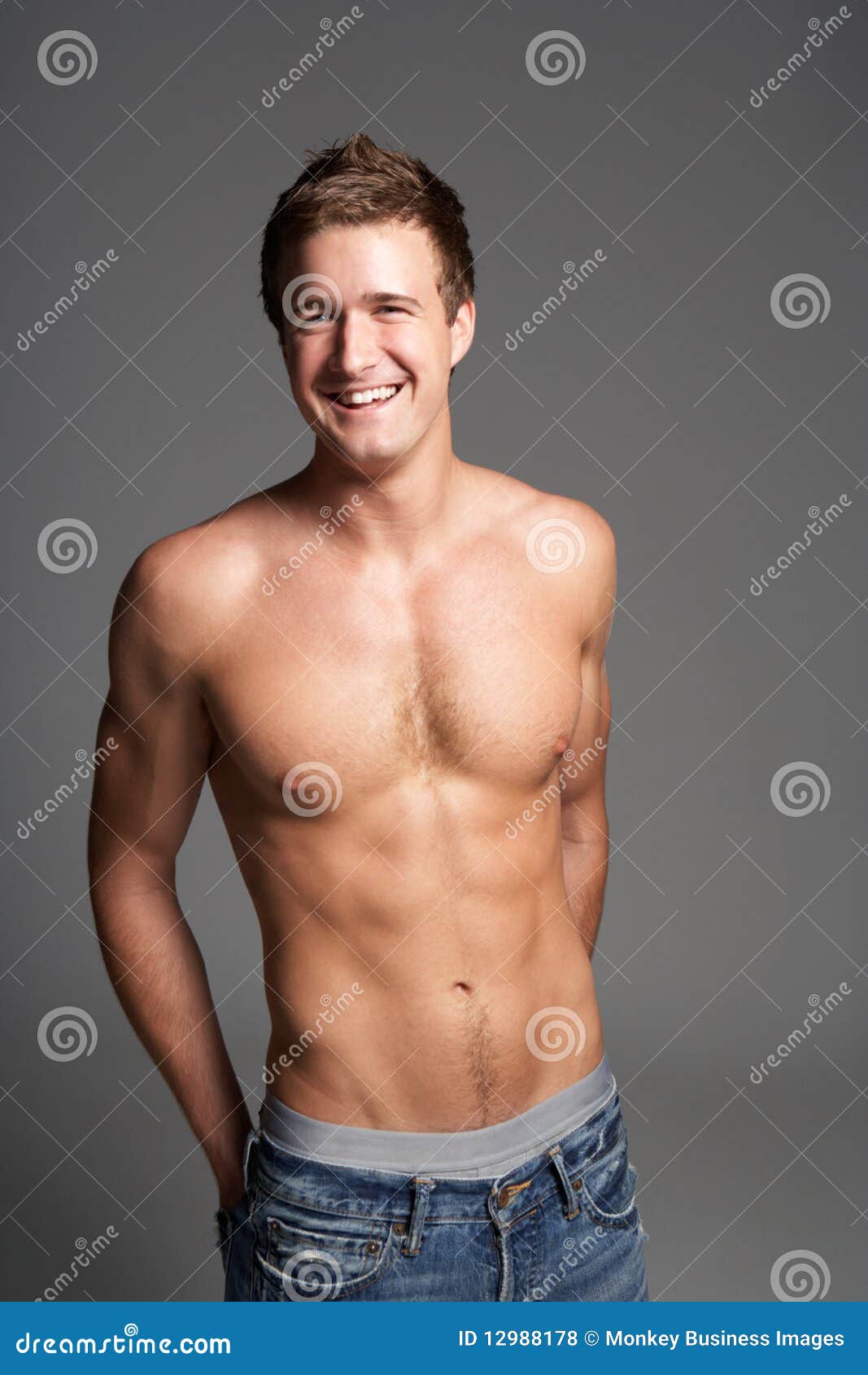 Studio Portrait of Bare Chested Muscular Young Man Stock Photo Image