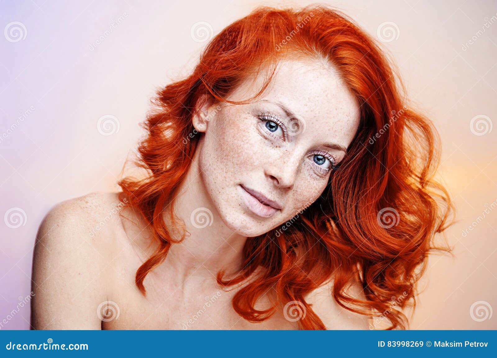 studio portrait of a beautiful redhead woman stock image