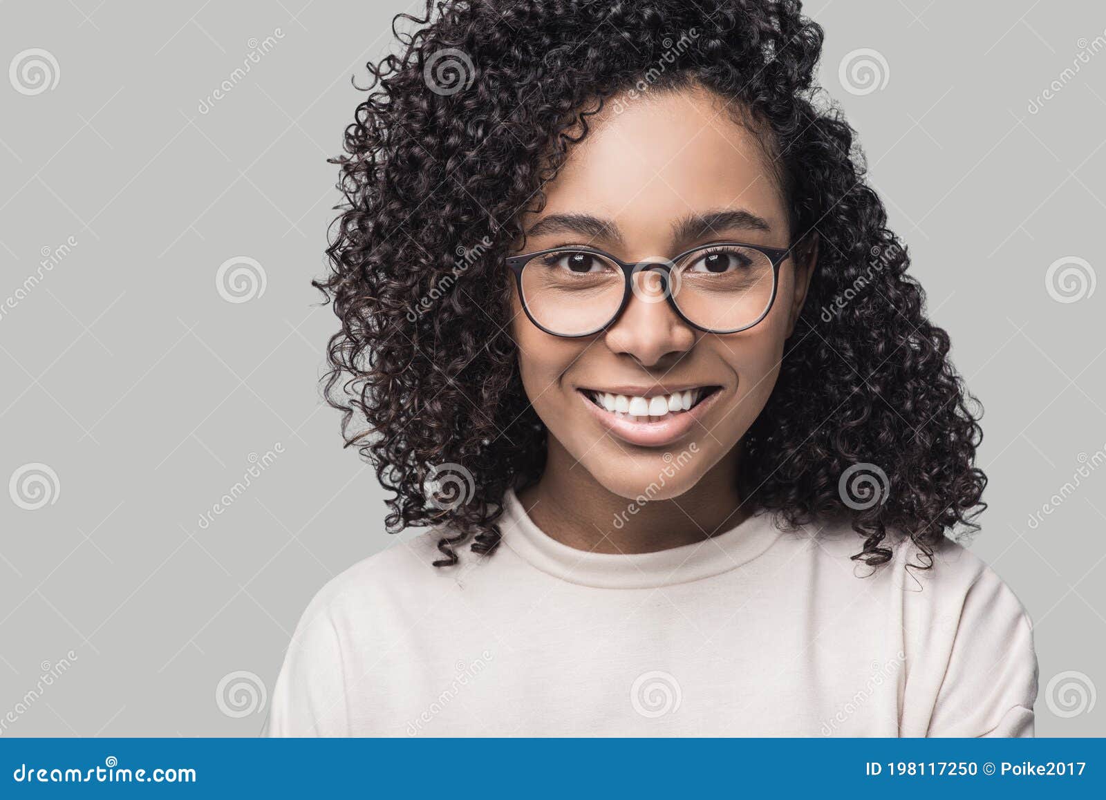Studio Portrait of a Beautiful Young Woman with Black Curly Hair. African  American Student Girl Close Up, Isolated on Grey Backgro Stock Photo -  Image of hairstyle, adult: 198117250
