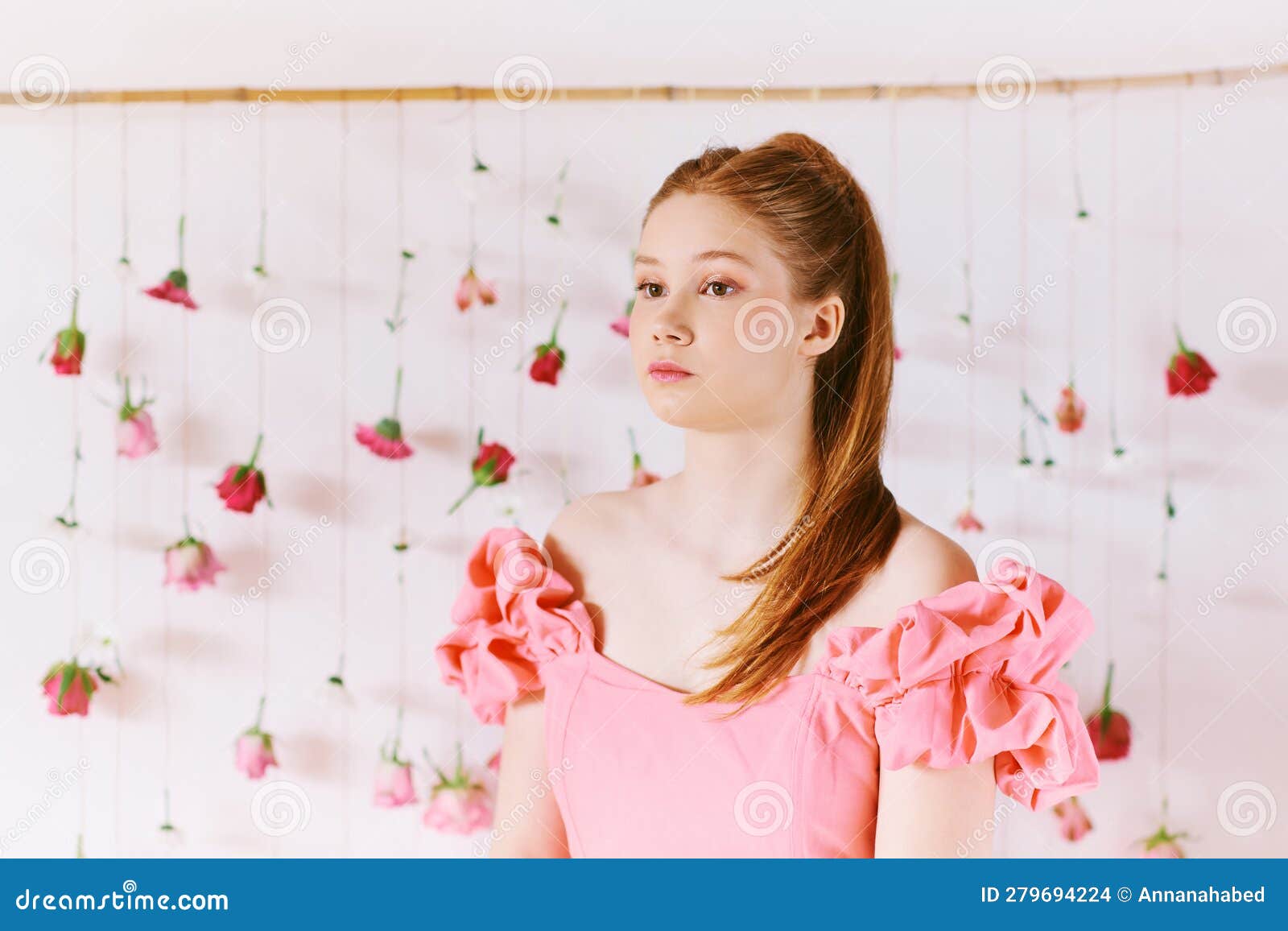 studio portrait of pretty young teenage 15 - 16 year old girl