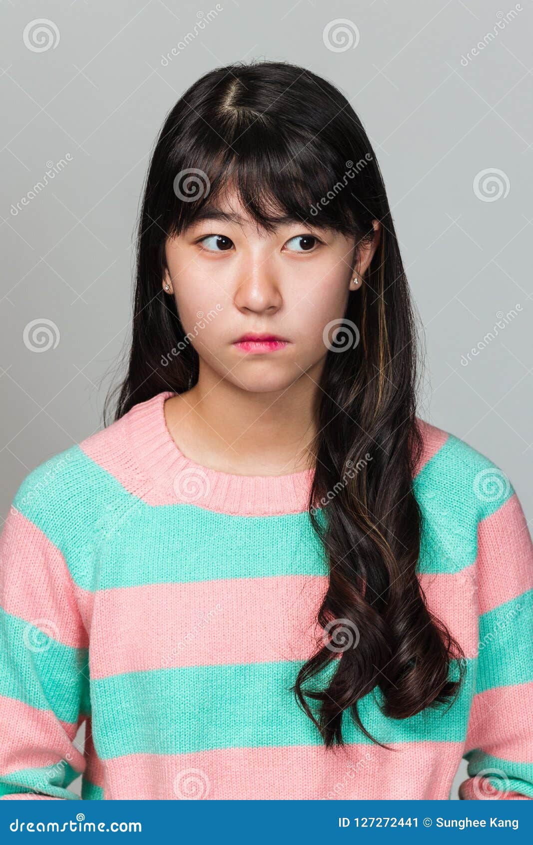 Studio Portrait of a Teenage East Asian Woman Looking Sideways Stock ...