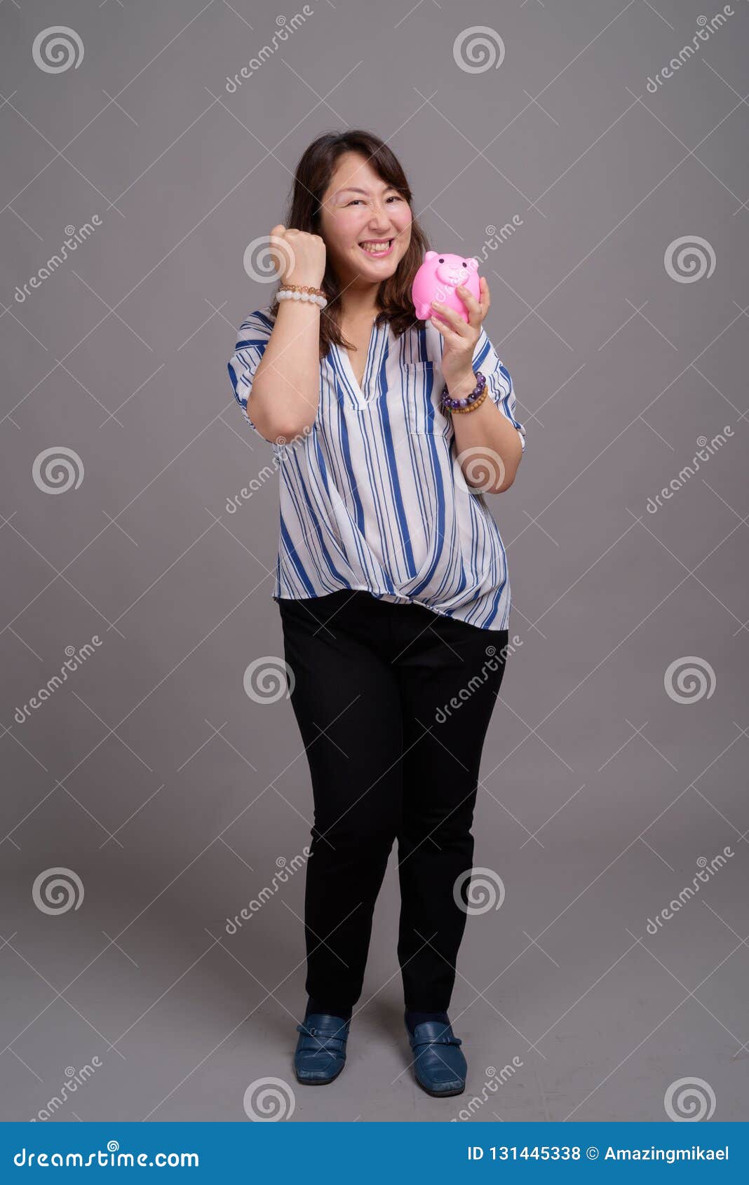 Portrait Of Japanese Mature Businesswoman Holding Piggy Bank Stock Photo Image Of Beautiful Adult