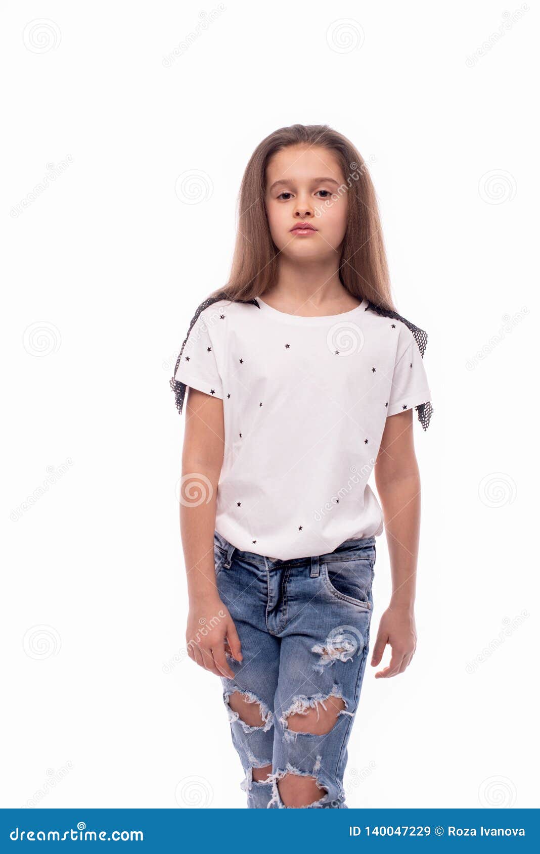 Studio Shot of a Serious Girl Wearing Jeans and White Blouse on a White ...
