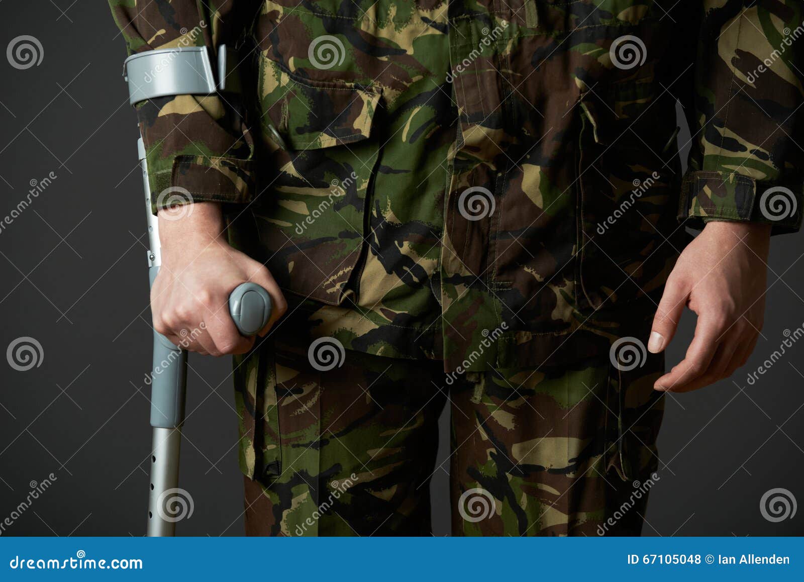 Studio Shot of Wounded Soldier Using Crutch Stock Photo Image of