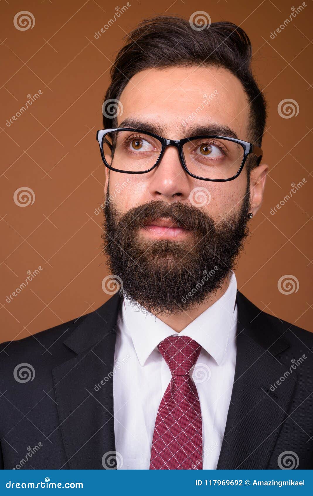 Young Handsome Bearded Persian Businessman Against Brown Backgro Stock ...