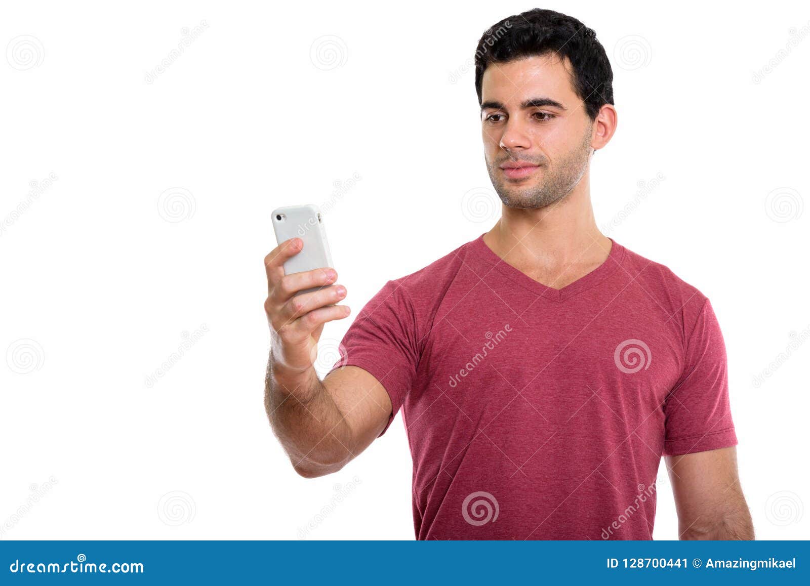 Studio Shot Of Young Handsome Hispanic Man Using Mobile Phone Stock ...