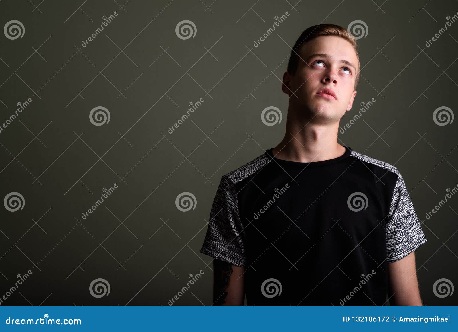 Young Handsome Man With Blond Hair Against Colored Background Stock ...