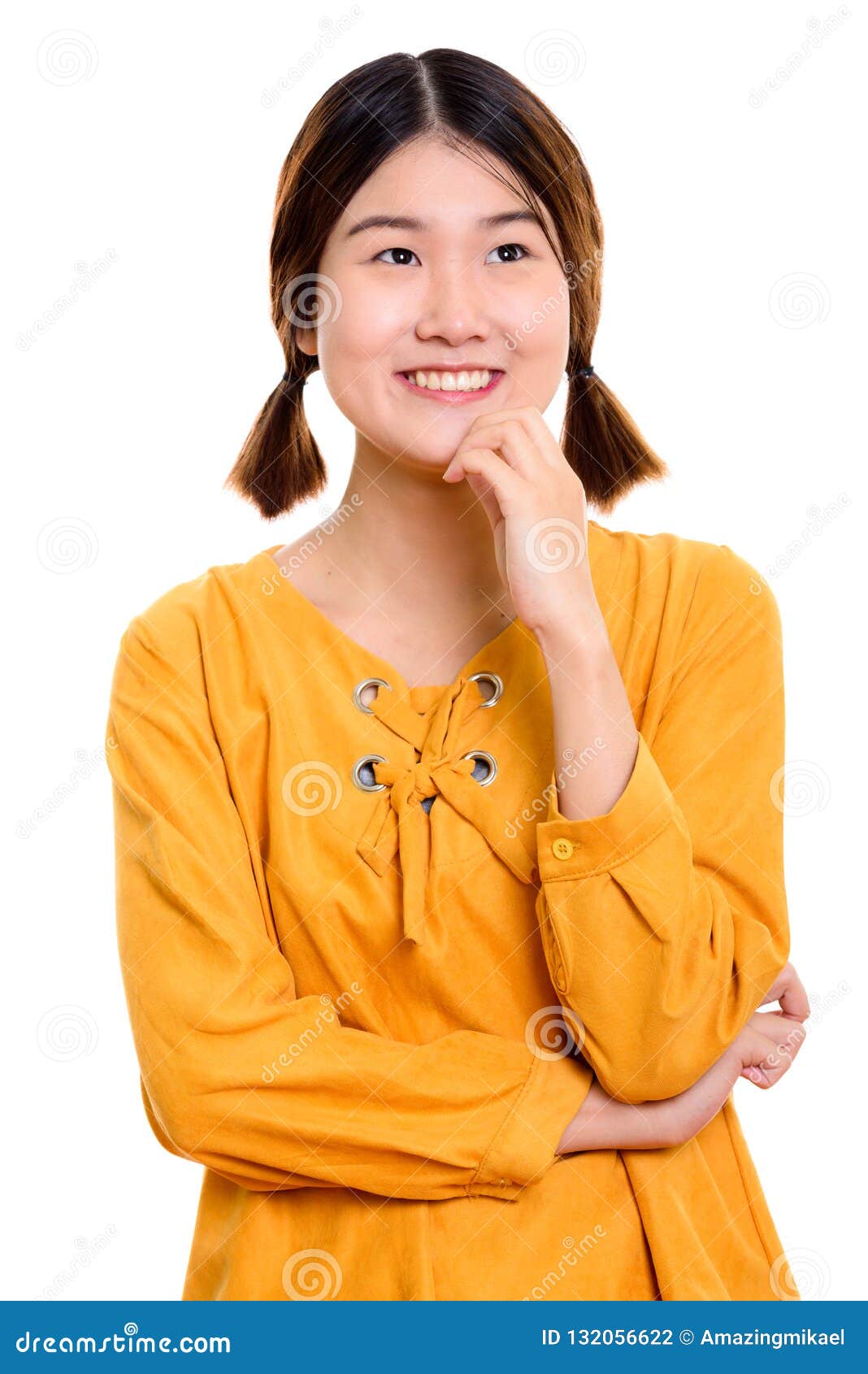 Studio Shot Of Young Happy Asian Woman Smiling While Thinking Stock ...