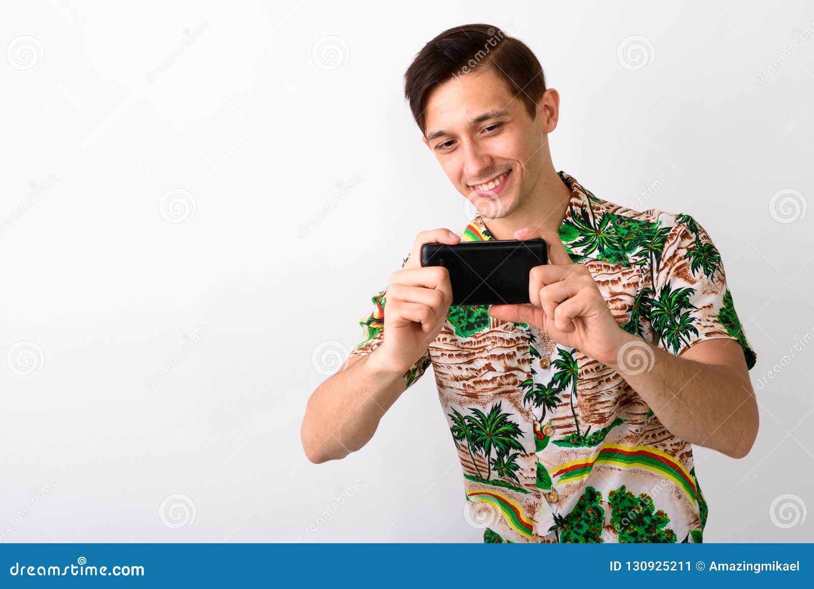 Studio Shot of Young Happy Tourist Man Smiling while Taking Pict Stock ...