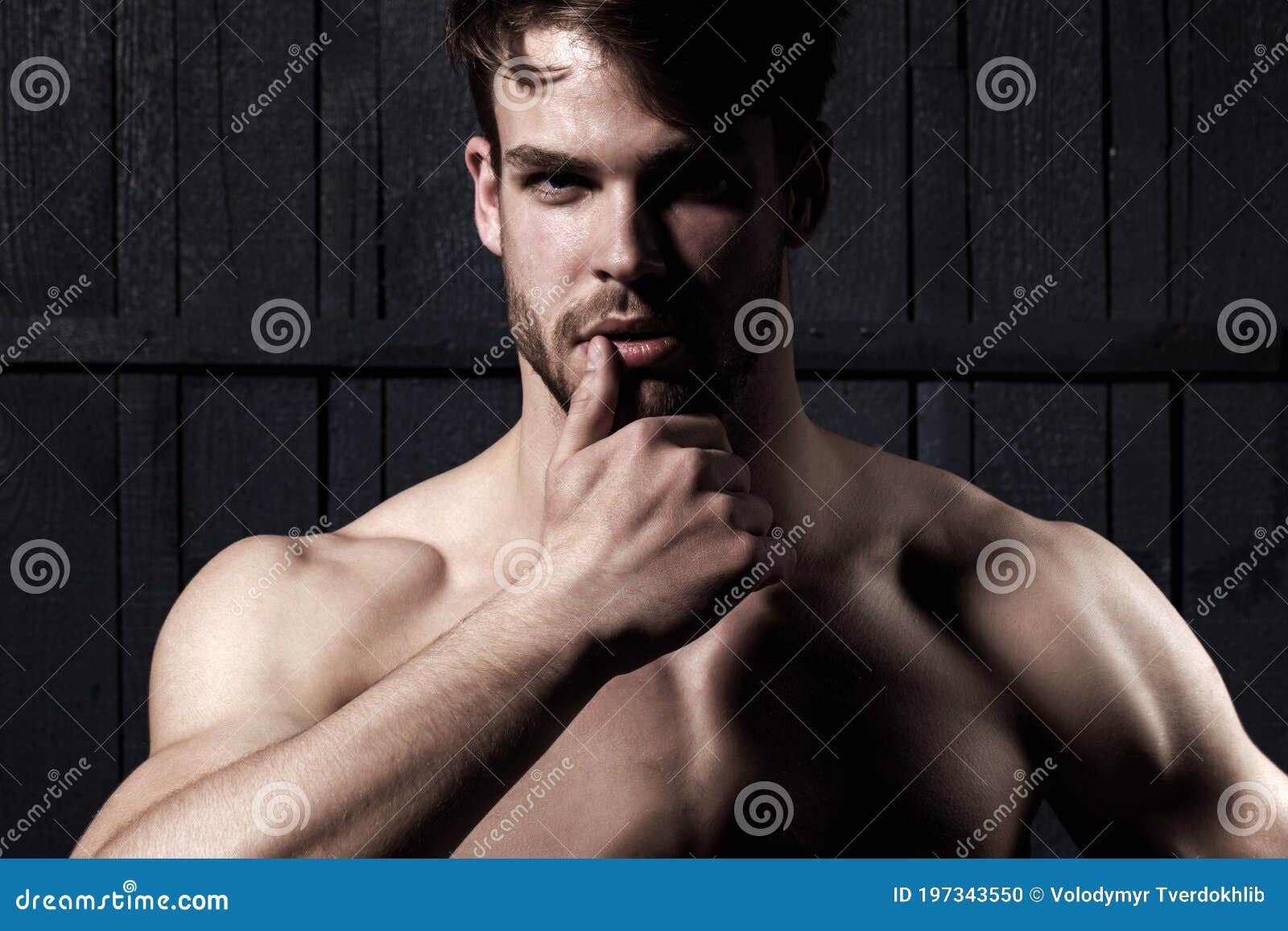 studio shot of young man looking at the camera. handsome guy with confident face. mens sexuality or attraction and