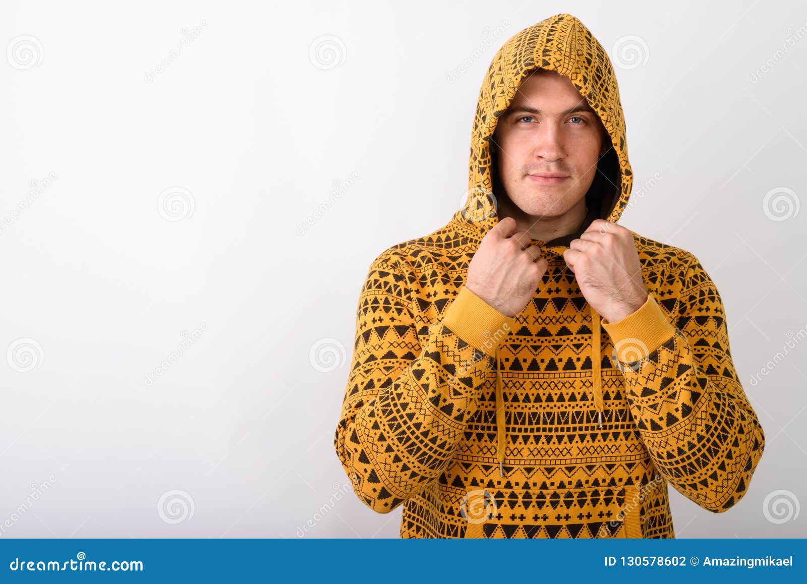 Studio Shot of Young Muscular Man Holding while Wearing Hoodie a Stock ...