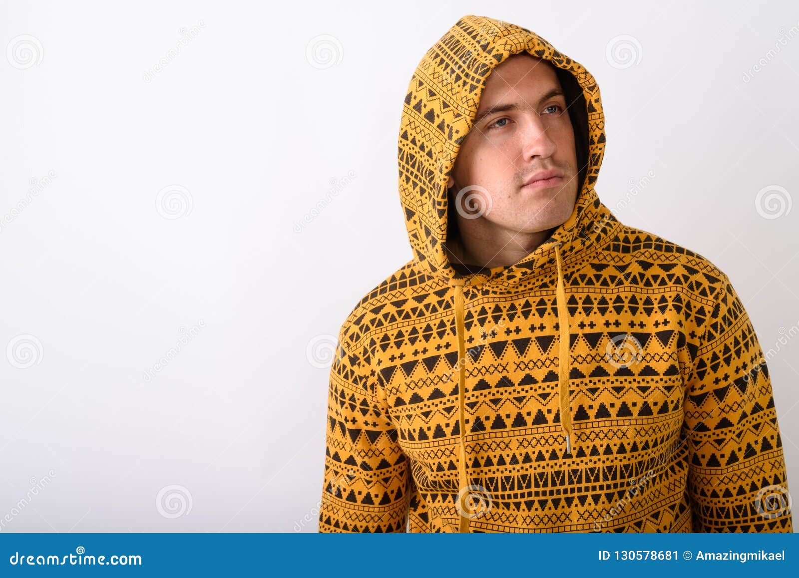 Studio Shot of Young Muscular Man Wearing Hoodie while Thinking Stock ...