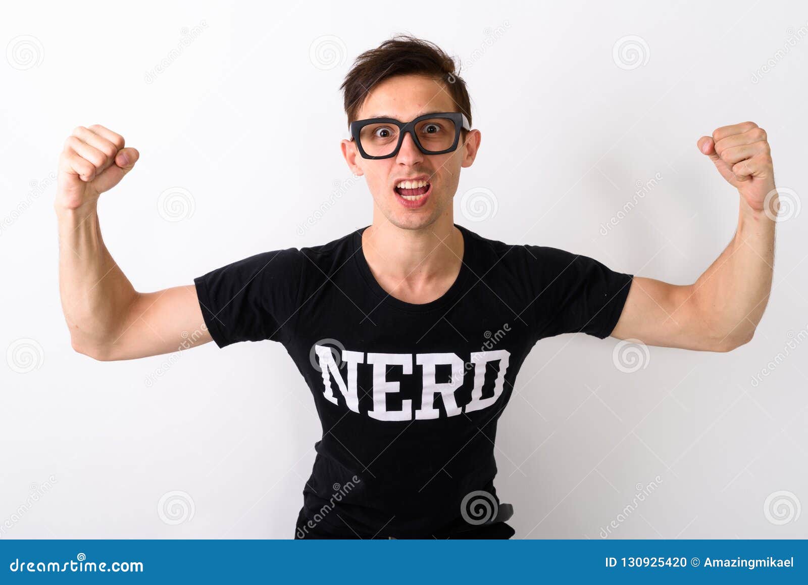 Studio Shot of Young Nerd Man Flexing Both Arms while Wearing Ey Stock ...