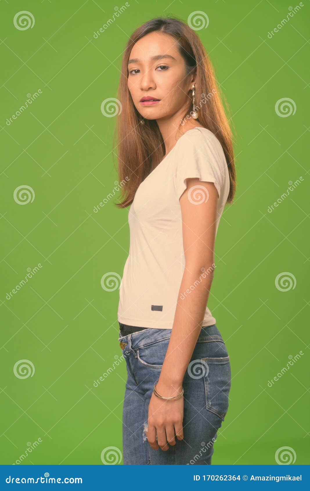 Young Slim Asian Woman Against Green Background