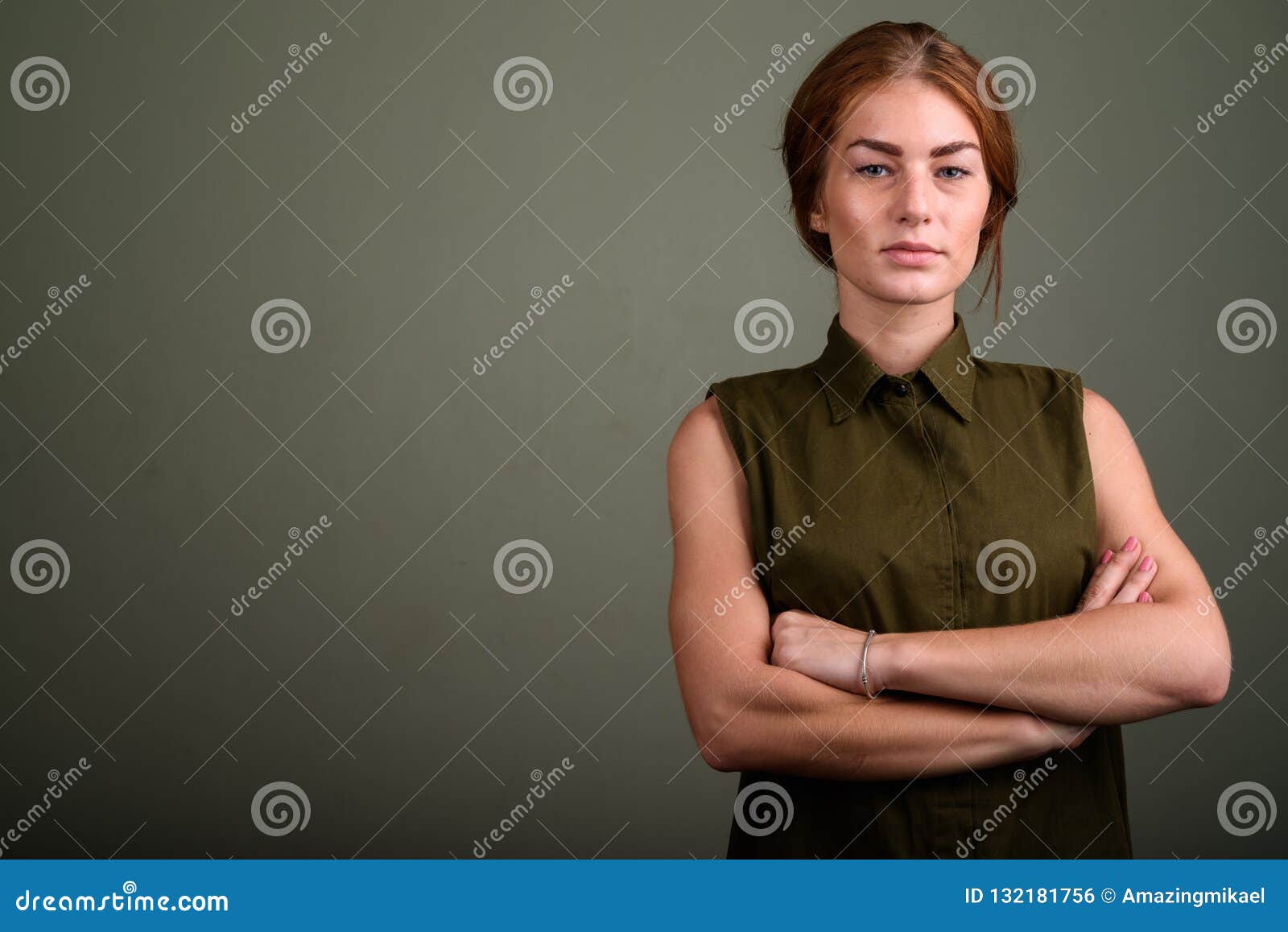 Young Woman Wearing Green Sleeveless Top Against Colored Backgro Stock ...