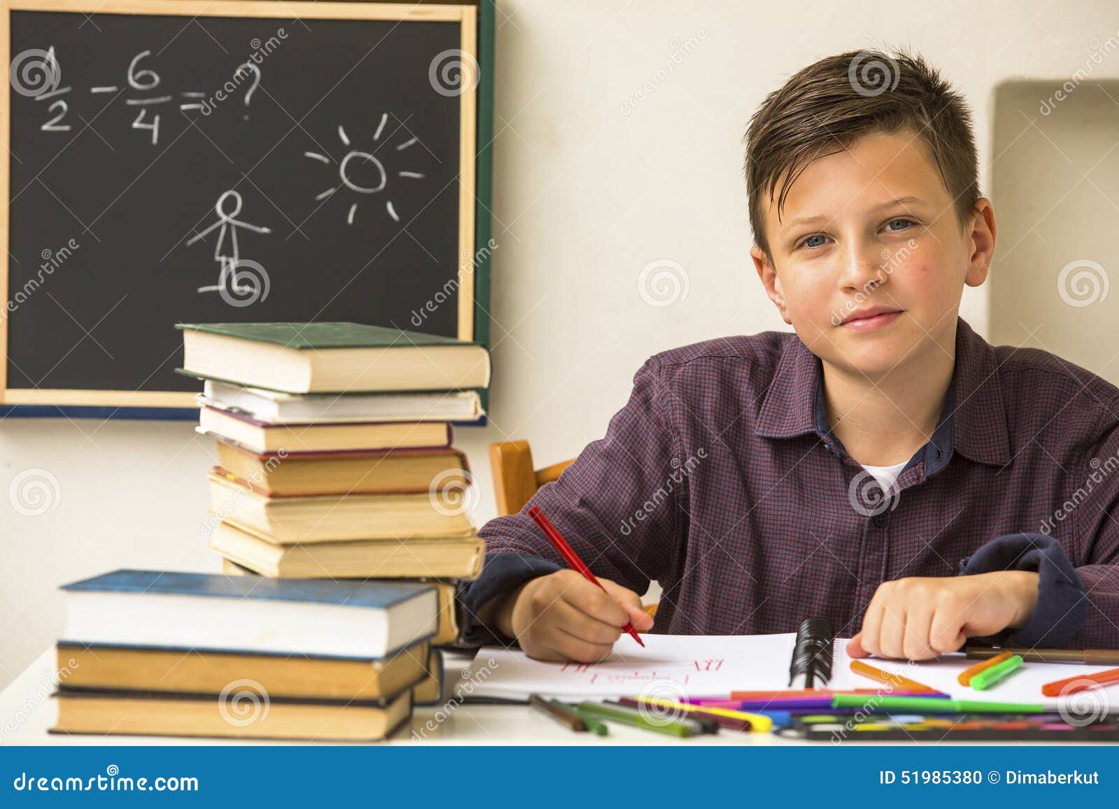 studious schoolboy doing homework. education.