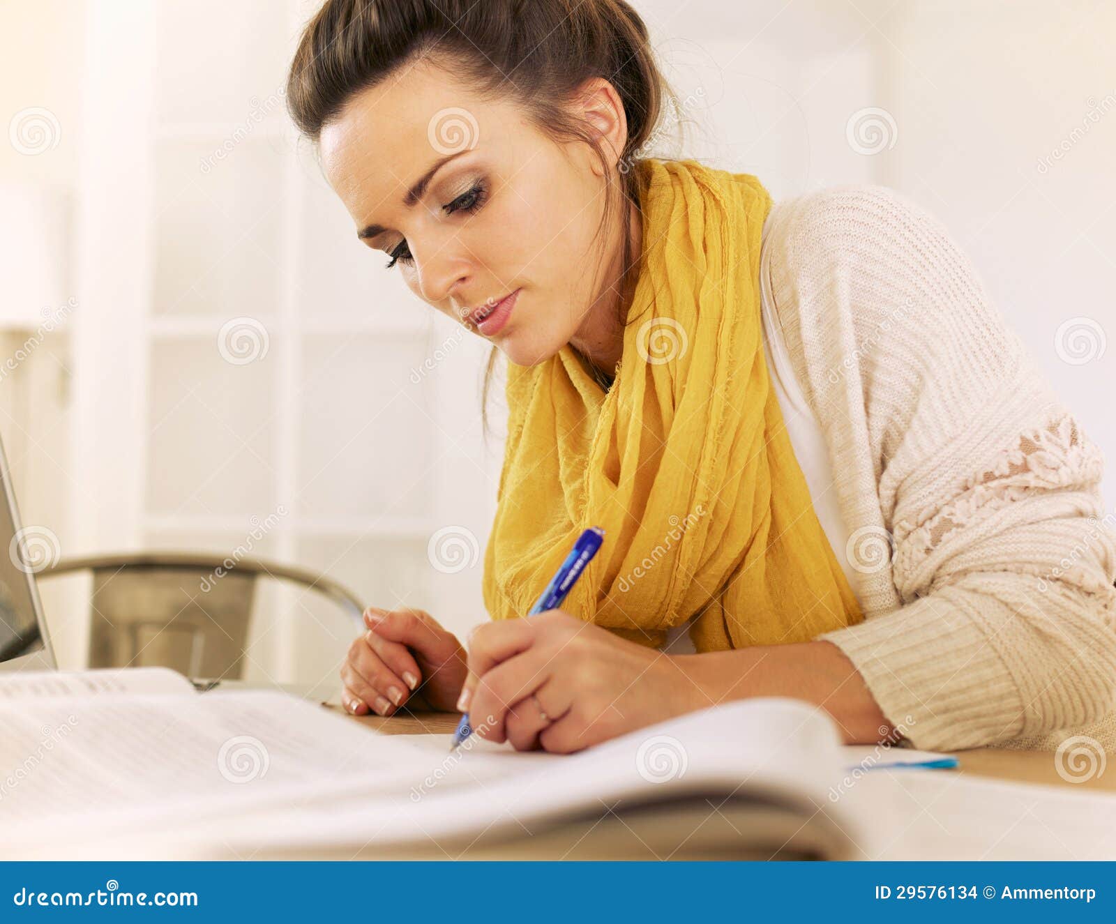 studious woman writing something 29576134