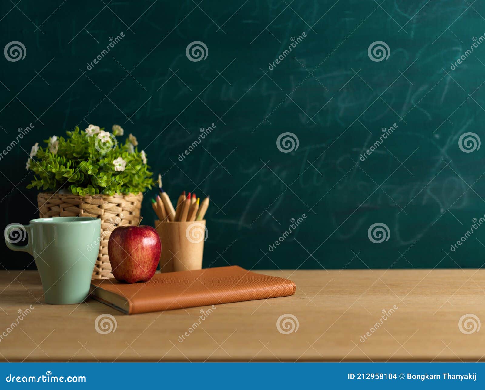 Study Table with Notebook, Apple, Pencils and Plant Pot in Classroom with Blackboard  Background Stock Photo - Image of college, supply: 212958104