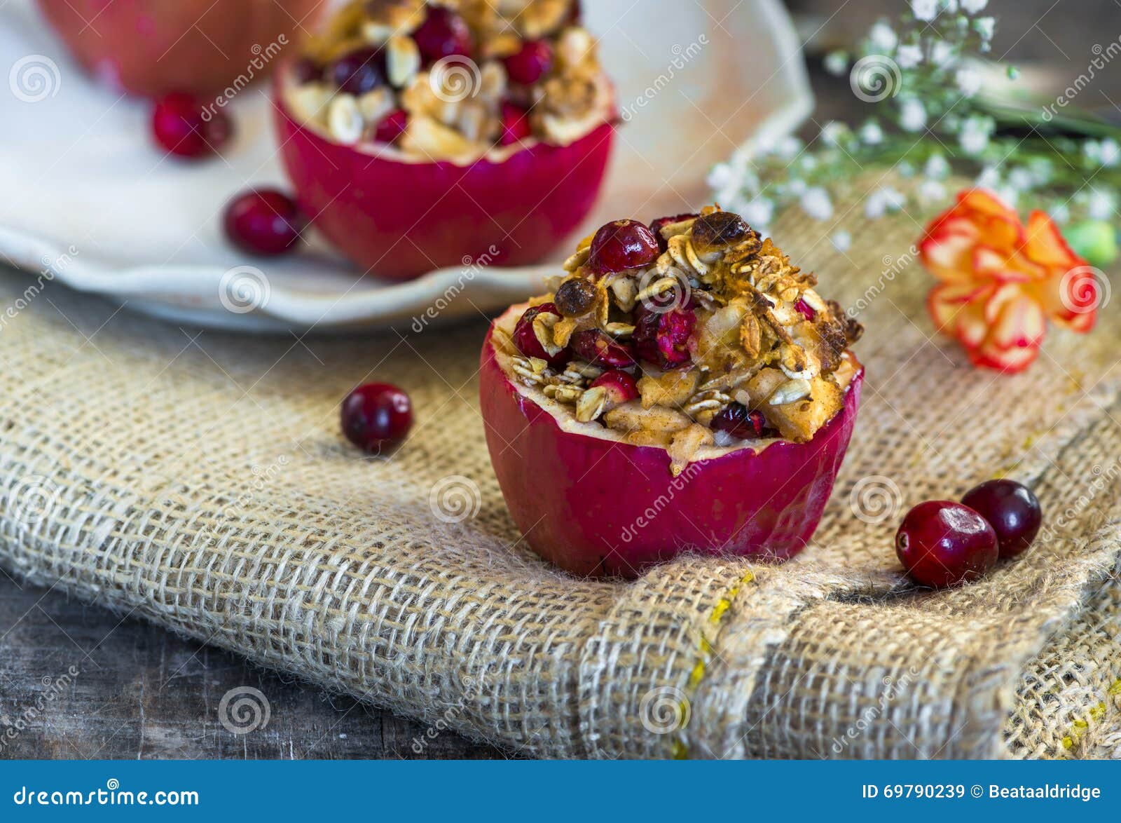 Stuffed Baked Red Apples with Granola, Cranberries and Marzipan Stock