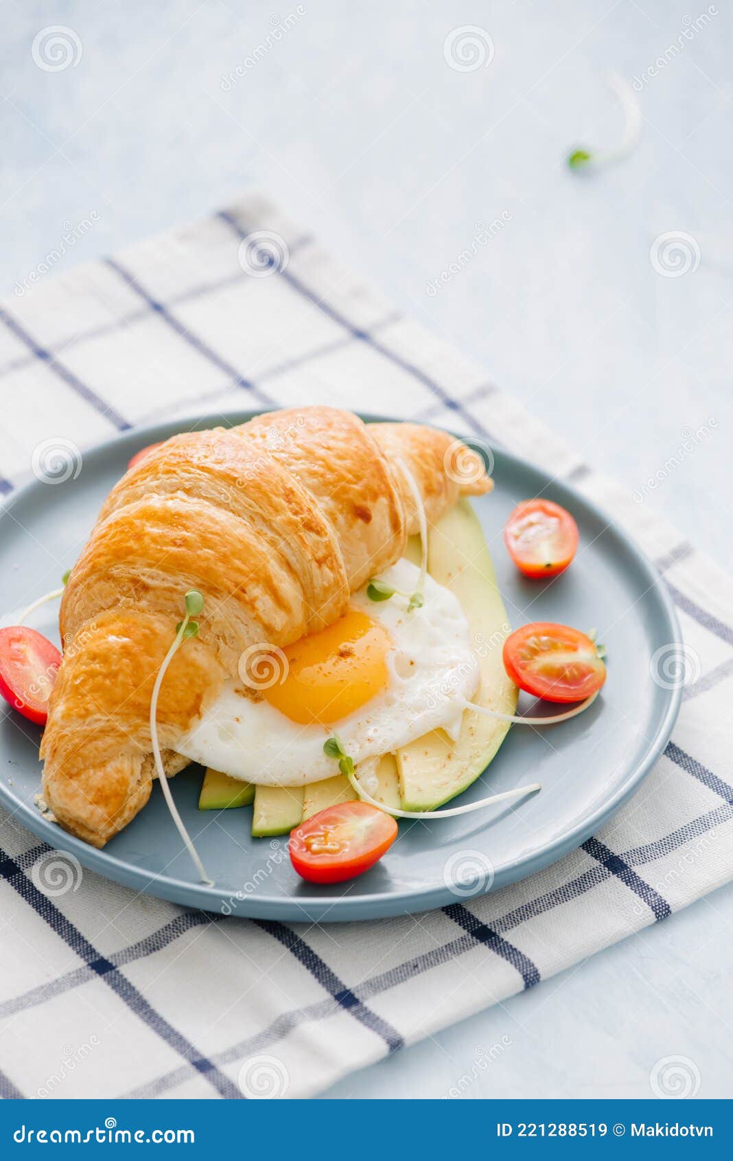 Stuffed Croissant with Avocado, Omelet Egg and Fresh Vegetable Stock