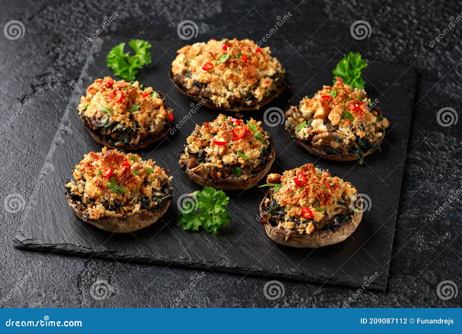 Stuffed Mushrooms with Spinach, Bread Crumbs and Cheese on Stone Board