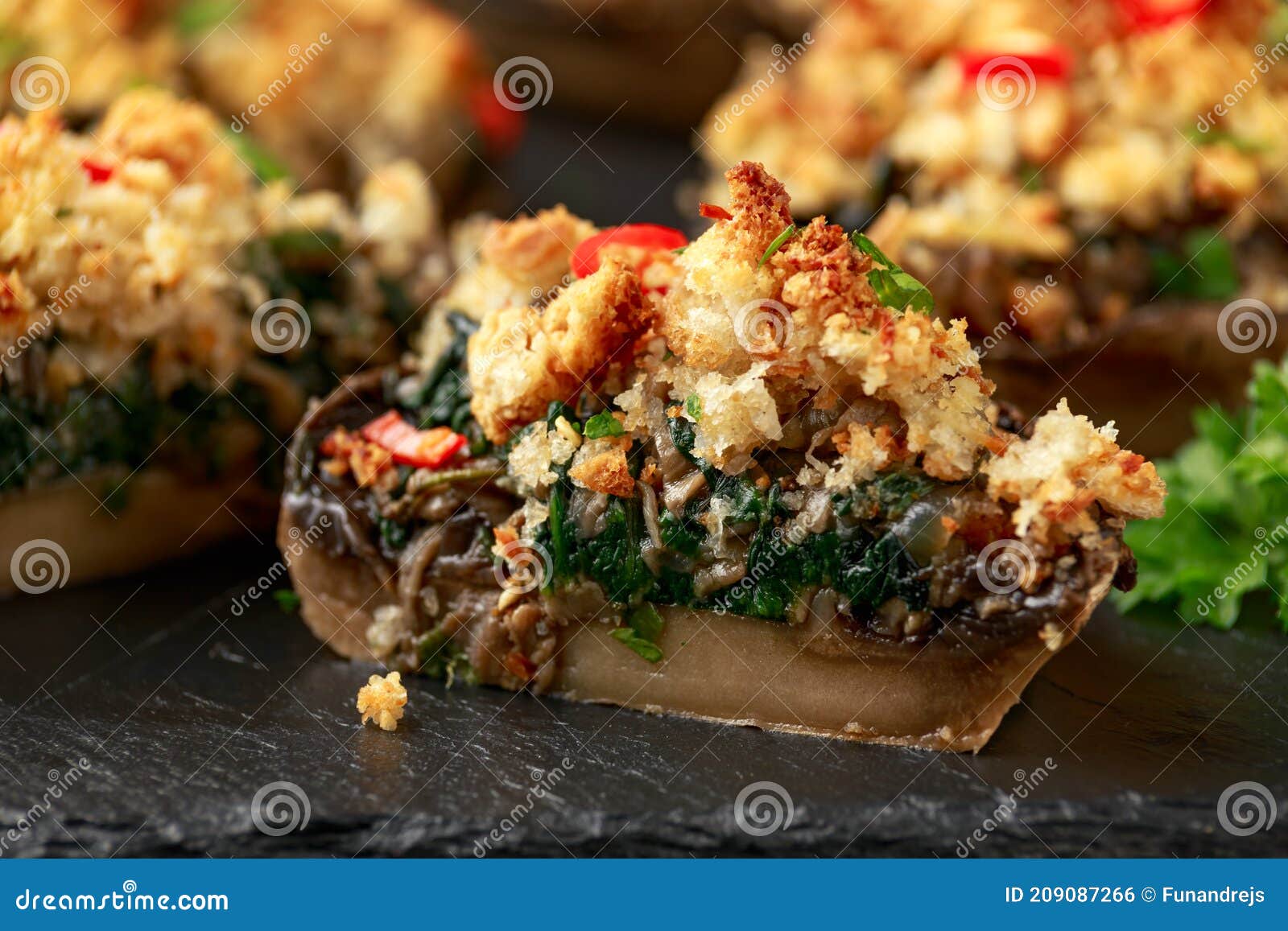 Stuffed Mushrooms with Spinach, Bread Crumbs and Cheese on Stone Board