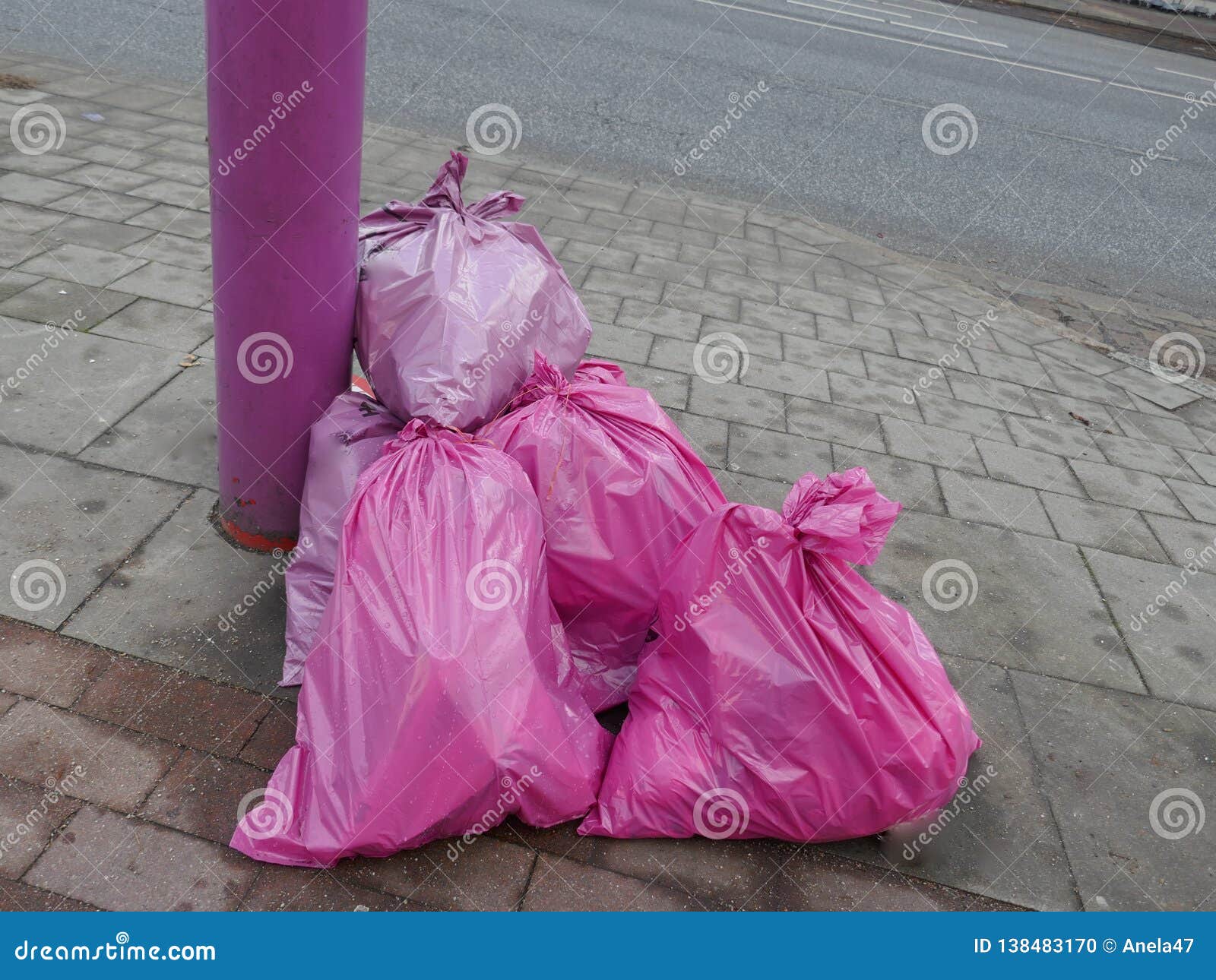 https://thumbs.dreamstime.com/z/stuffed-pink-garbage-bags-roadside-ready-to-pick-up-stuffed-pink-garbage-bags-roadside-ready-to-pick-up-138483170.jpg