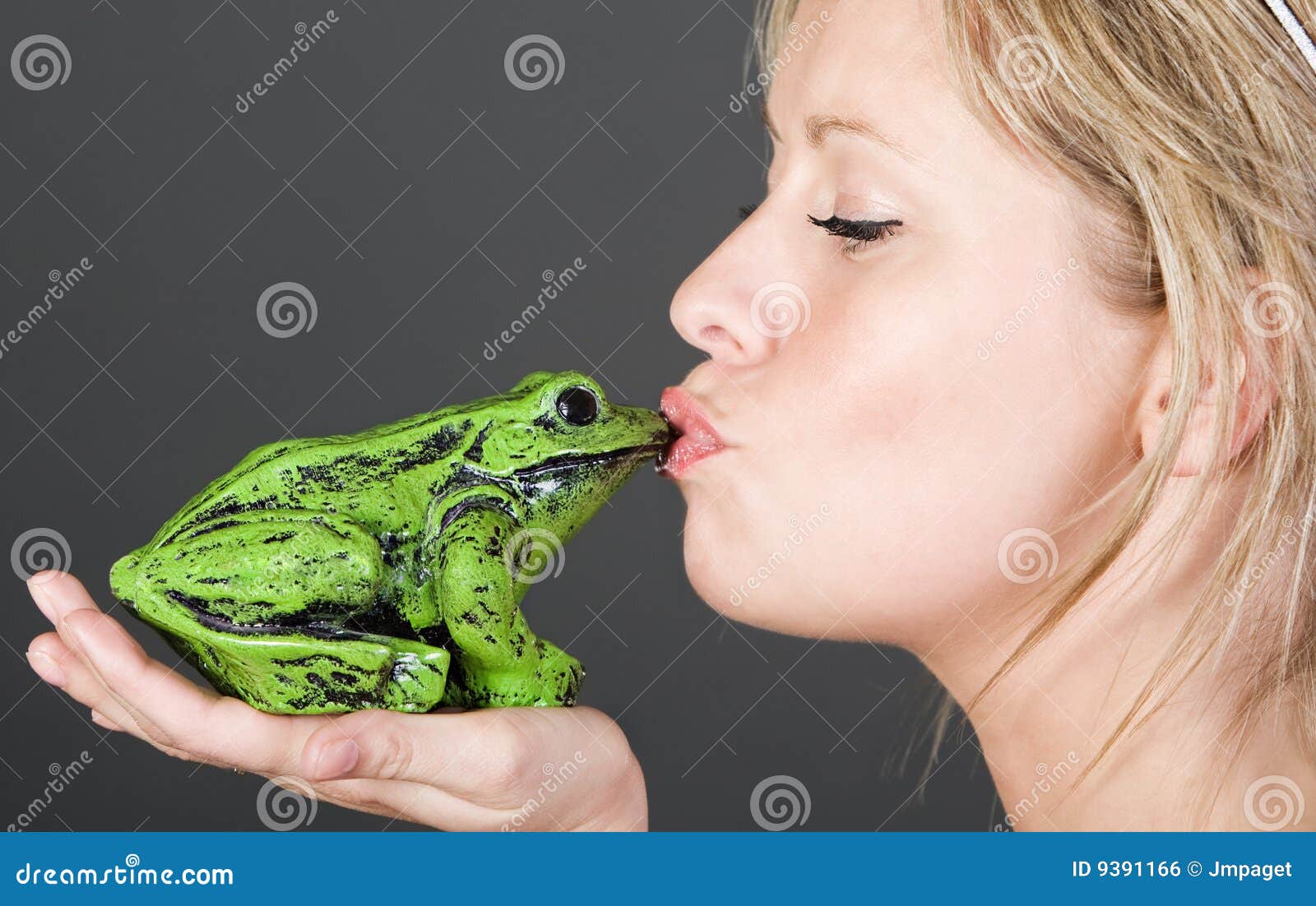 stunning blonde girl kissing a frog