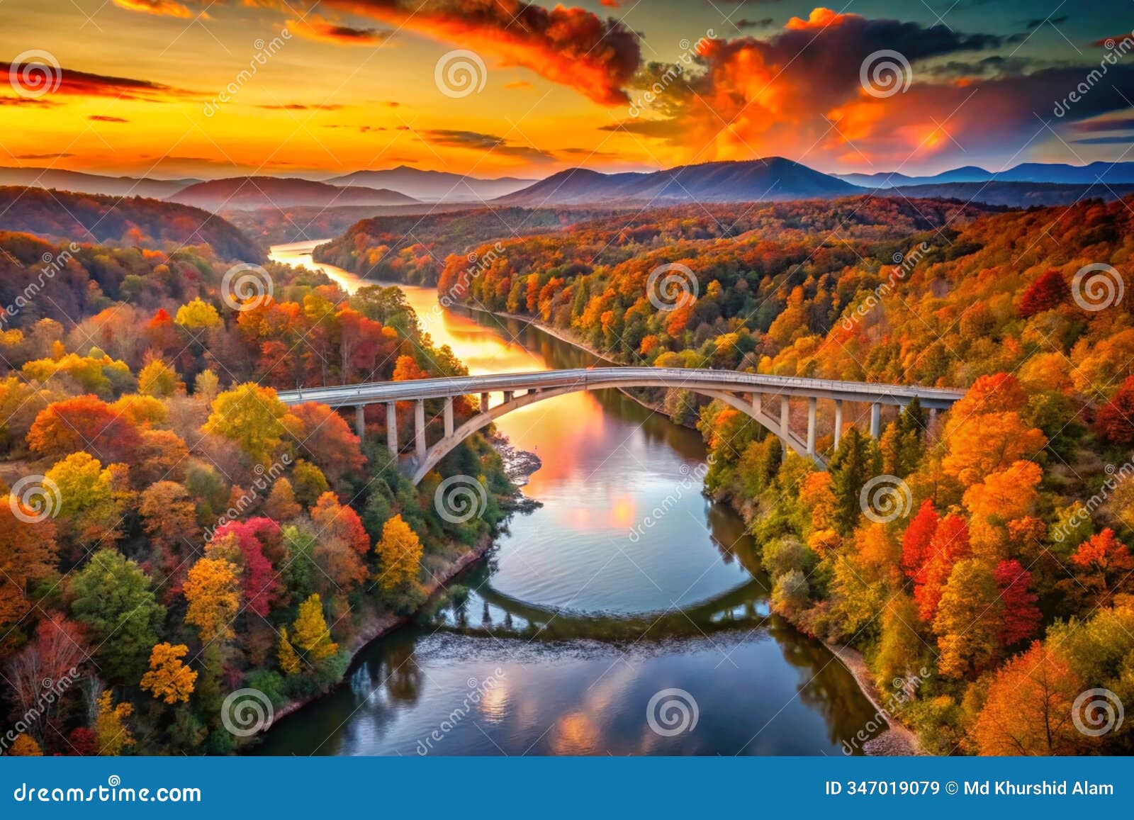 stunning drone shot of a scenic bridge and river surrounded by colorful fall trees, ideal wallpaper background