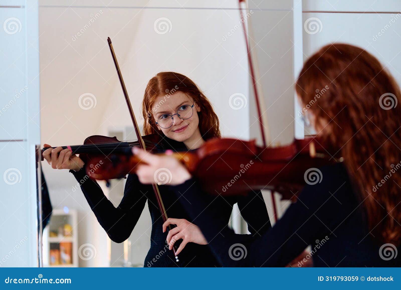 stunning redhead musician poses with violin in captivating portrait