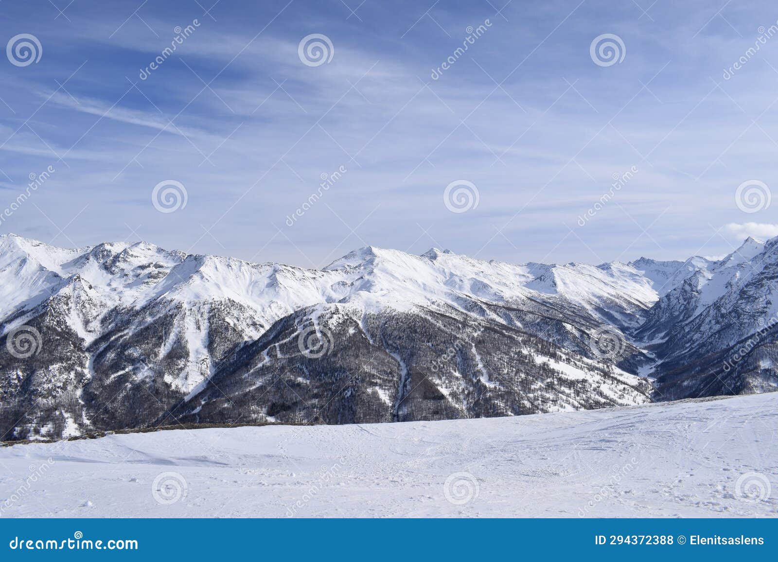 stunning snowcapped mountain peaks from the top of italian ski resort