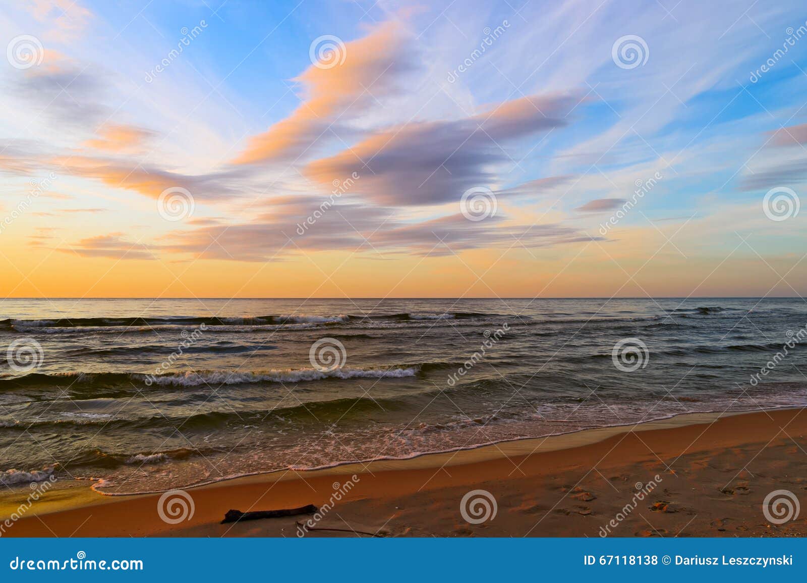 stunning stratus cloud formations at sunset over the baltic sea.
