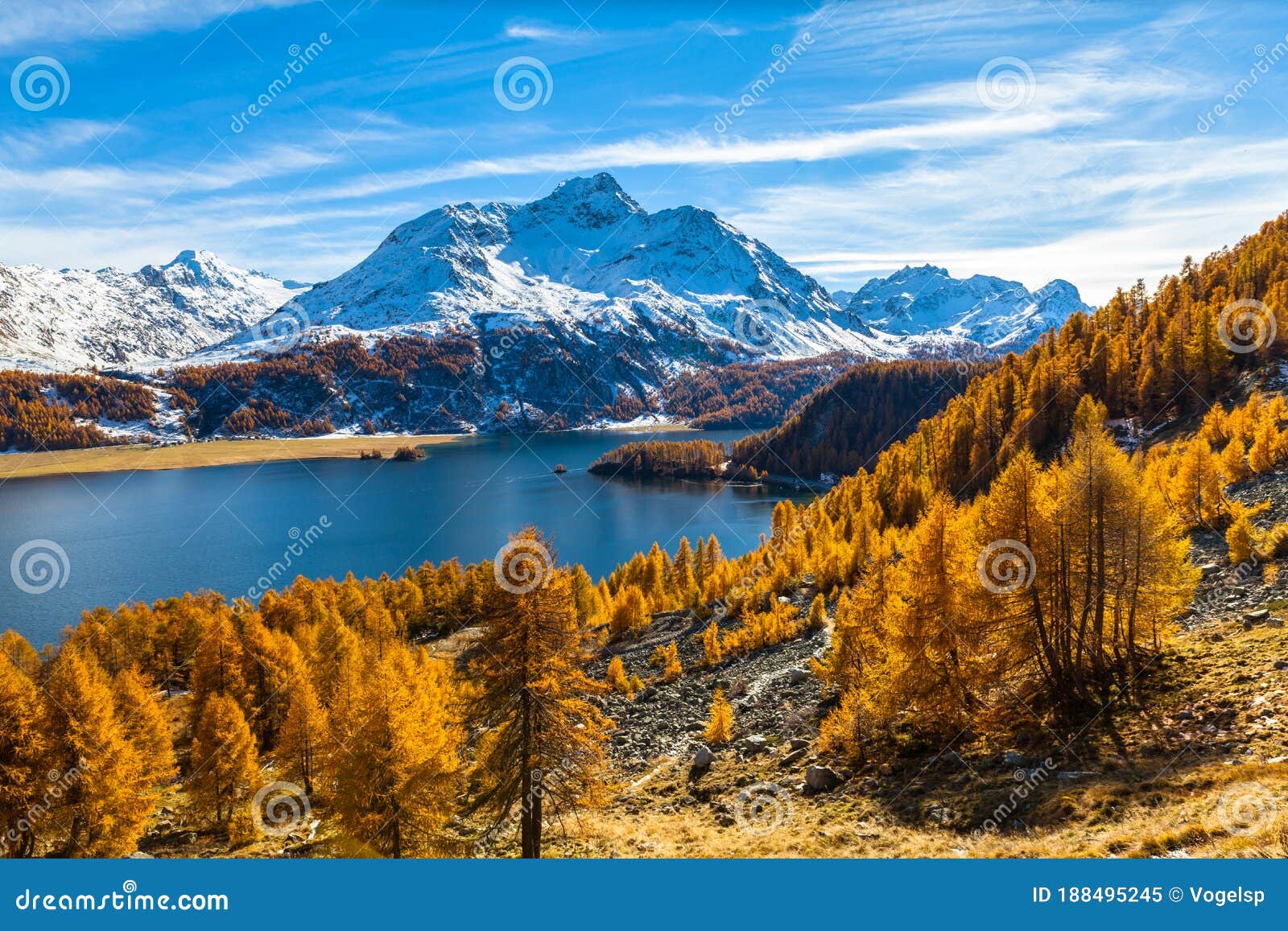 stunning view of sils lake and piz da la margna in golden autumn