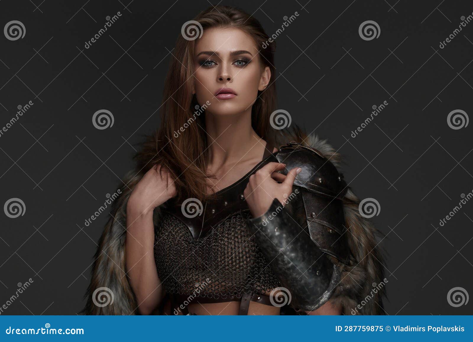 stunning viking model dressed in chainmail armor and fur
