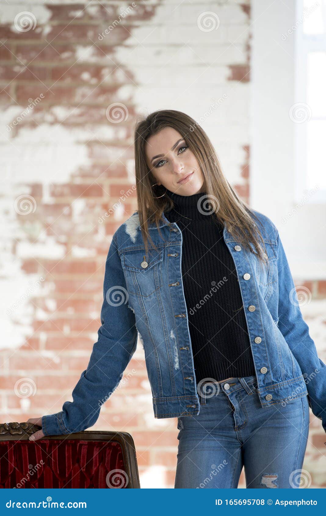 Cute eleven-year-old girl posing in a denim jacket. Stock Photo | Adobe  Stock